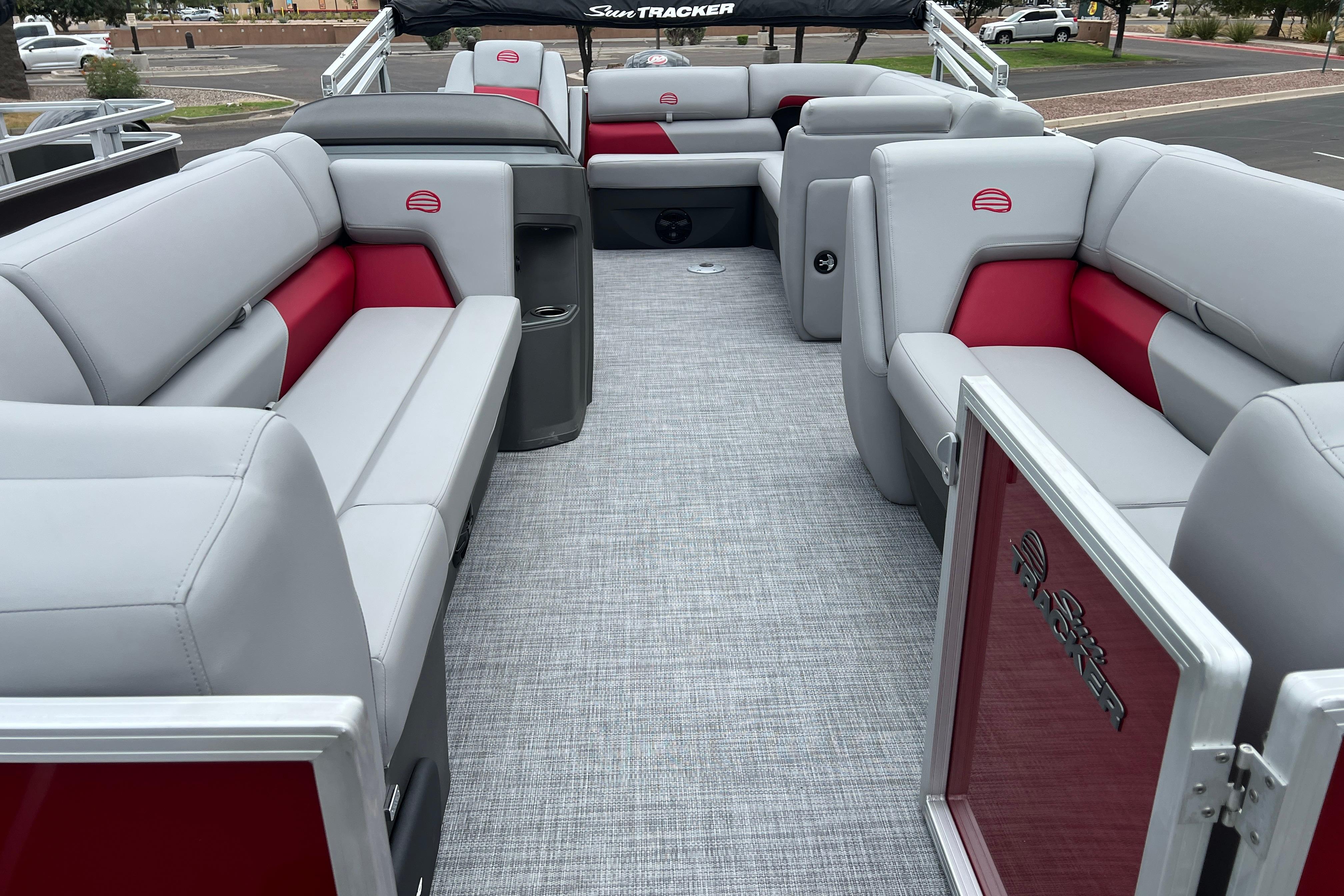 2026 Sun Tracker Party Barge 20 DLX interior with gray and red seating, spacious layout.