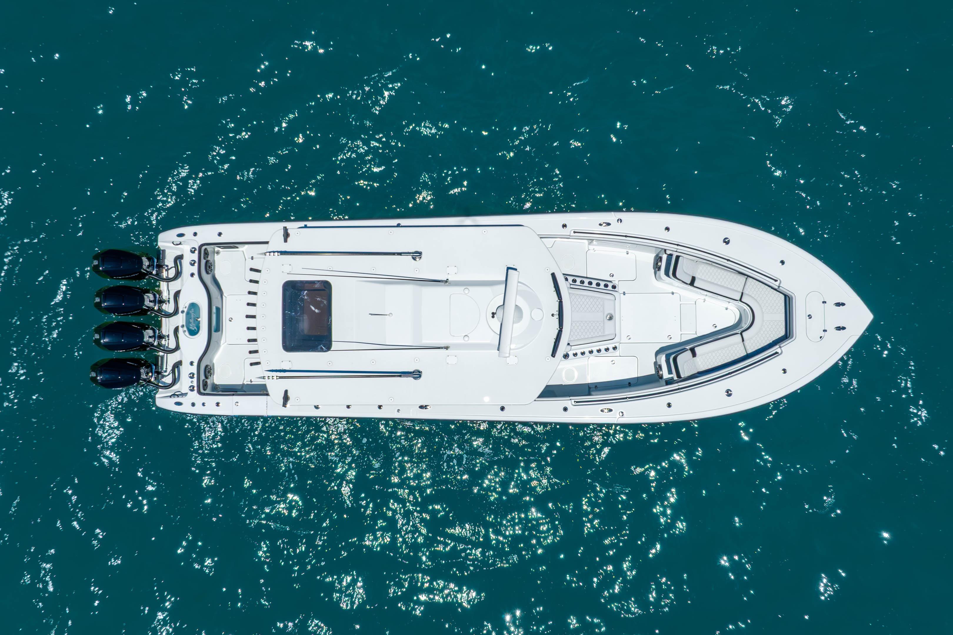 Aerial view of 2024 Yellowfin 42 Offshore boat on clear blue water.