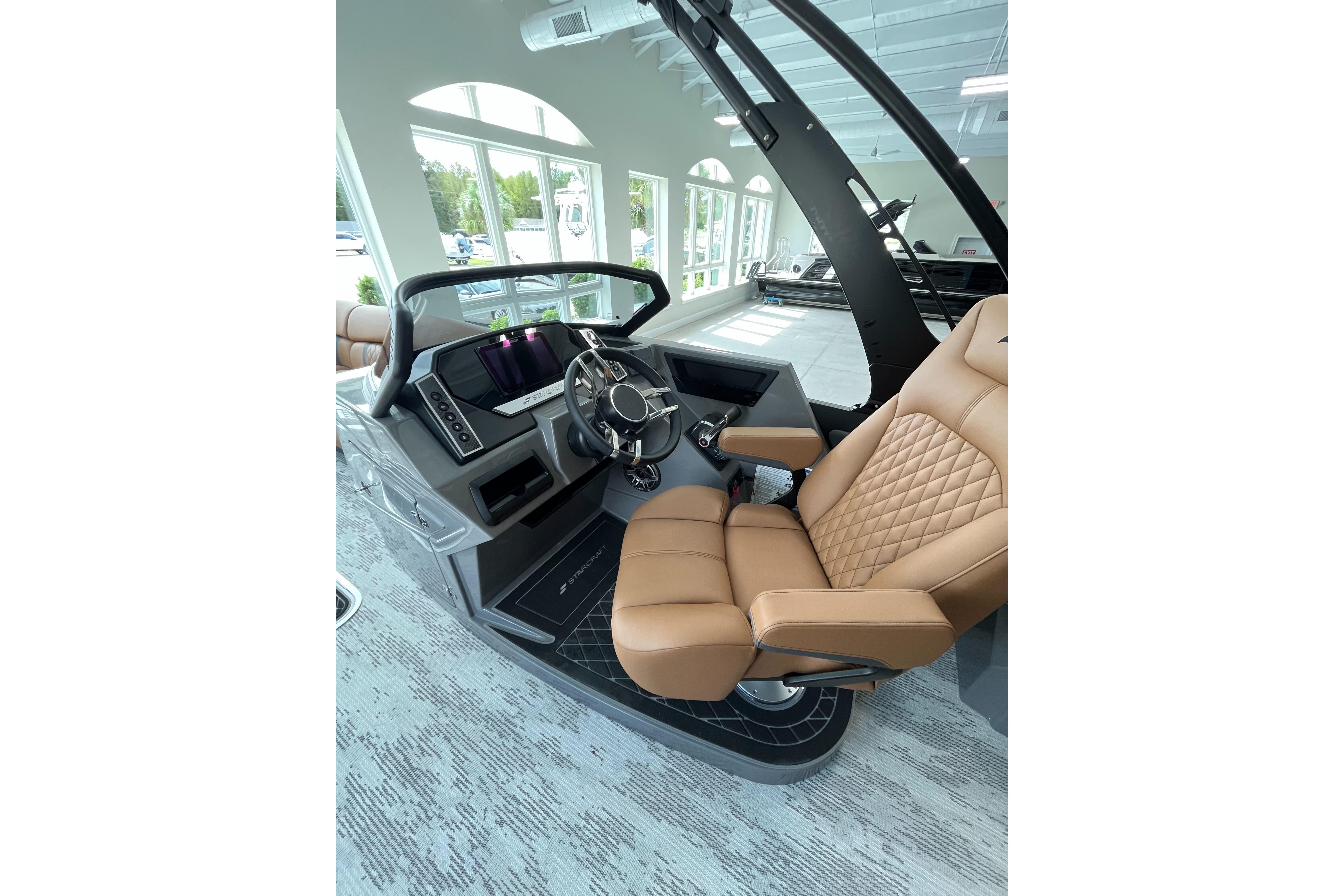 Luxurious interior of 2026 Starcraft RX 25 DL DC boat with tan leather seating.