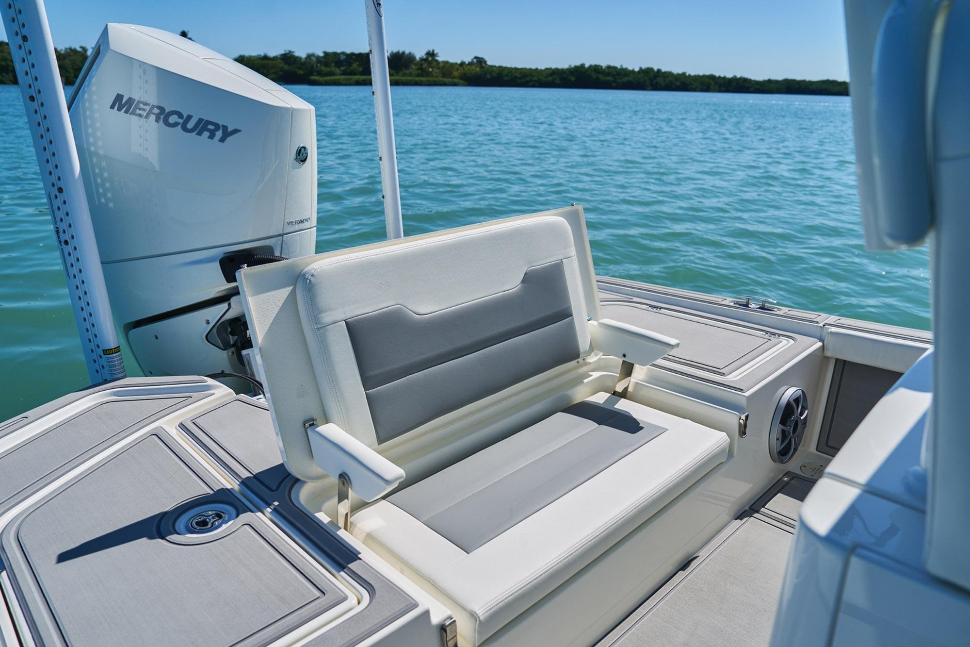 2026 Mako 24 APEX boat with Mercury engine on calm water.