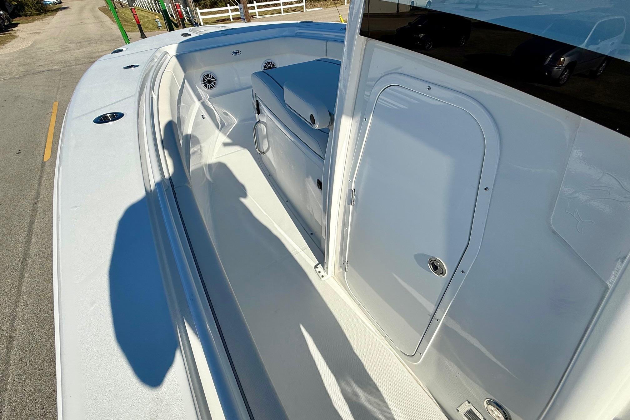 2026 Sea Hunt Ultra 275 Coffin Box boat interior with storage and seating.