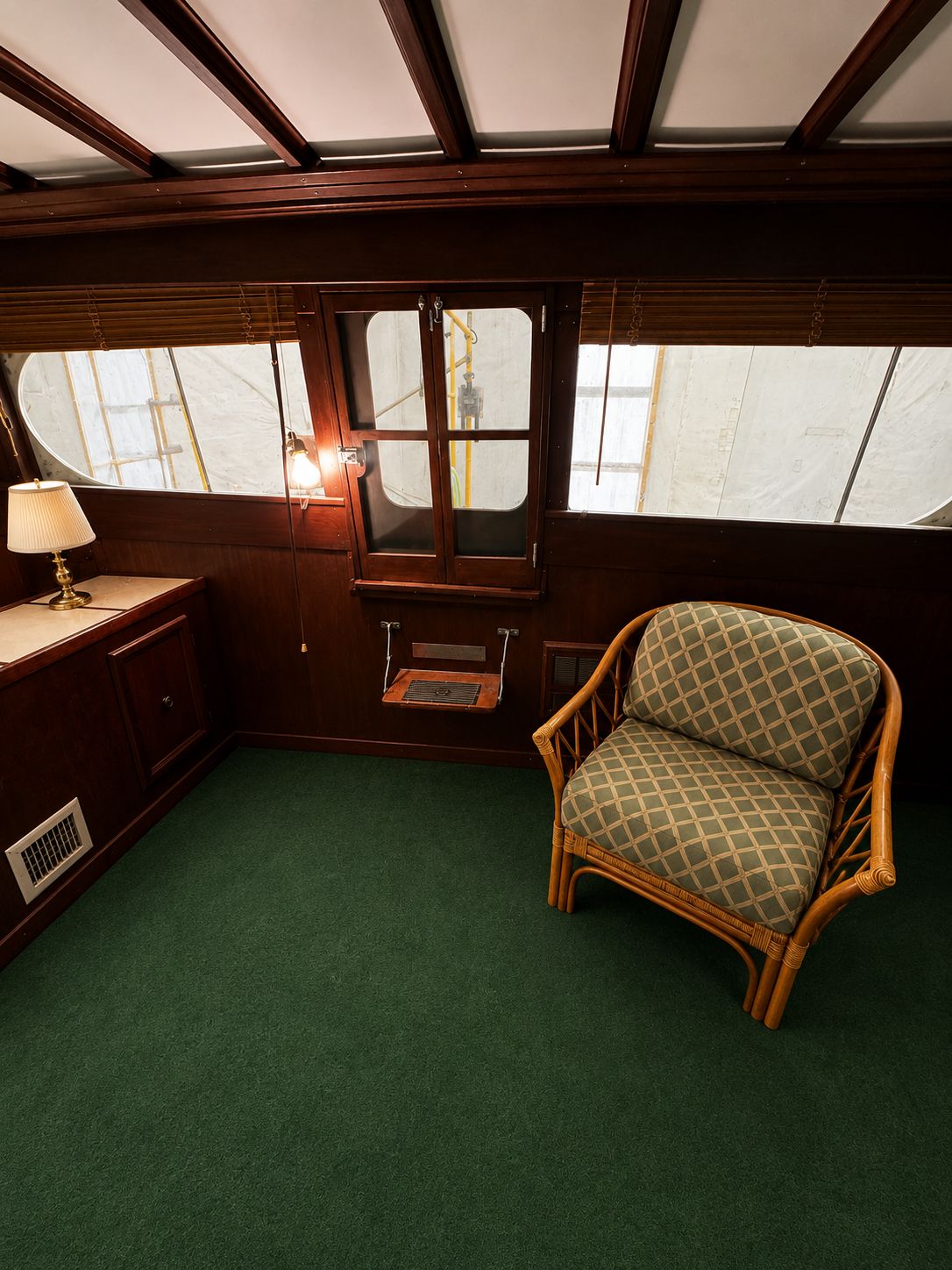 Interior of a 1951 Chris-Craft 50 Catalina with green carpet.