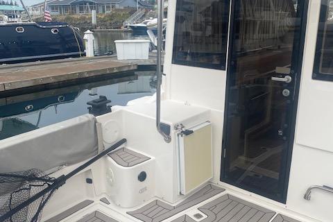 2020 Cutwater C-32 C boat docked, featuring a clean deck and modern design.