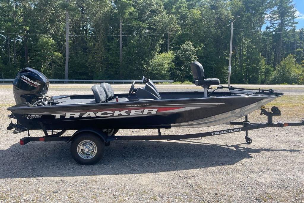 2026 Tracker Pro Team 175 Crappie Edition boat on trailer, parked outdoors.