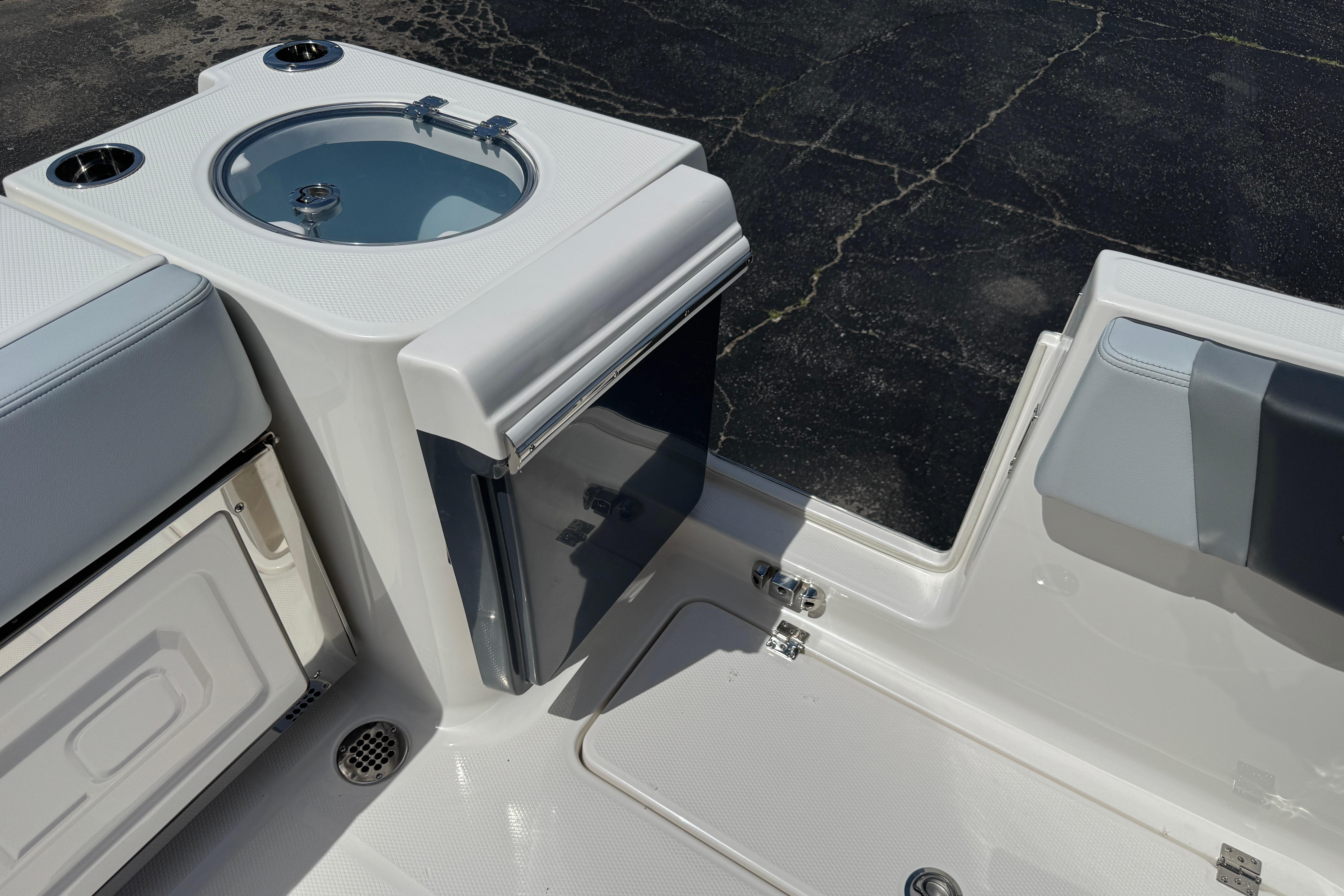 2026 Robalo R250 Center Console boat interior with seating and storage features.