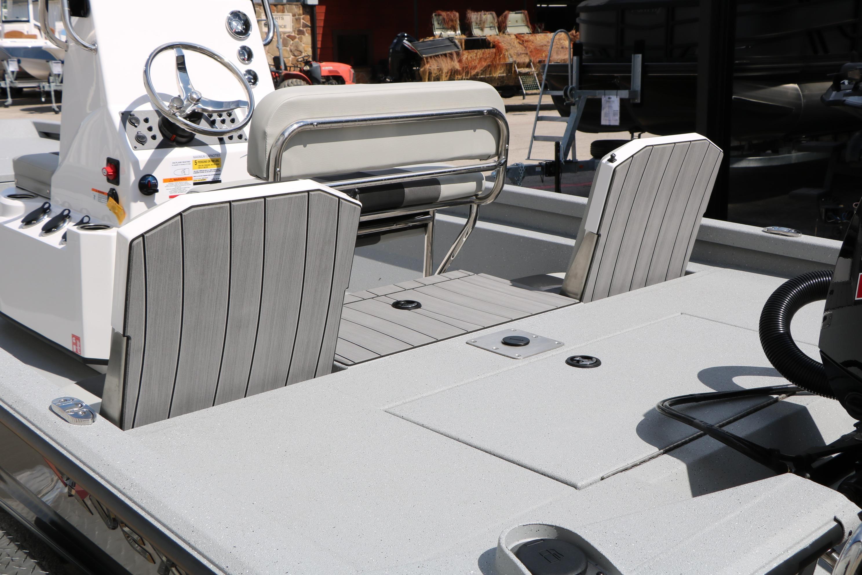 2026 Vexus Defender 201 boat interior with modern seating and steering console.