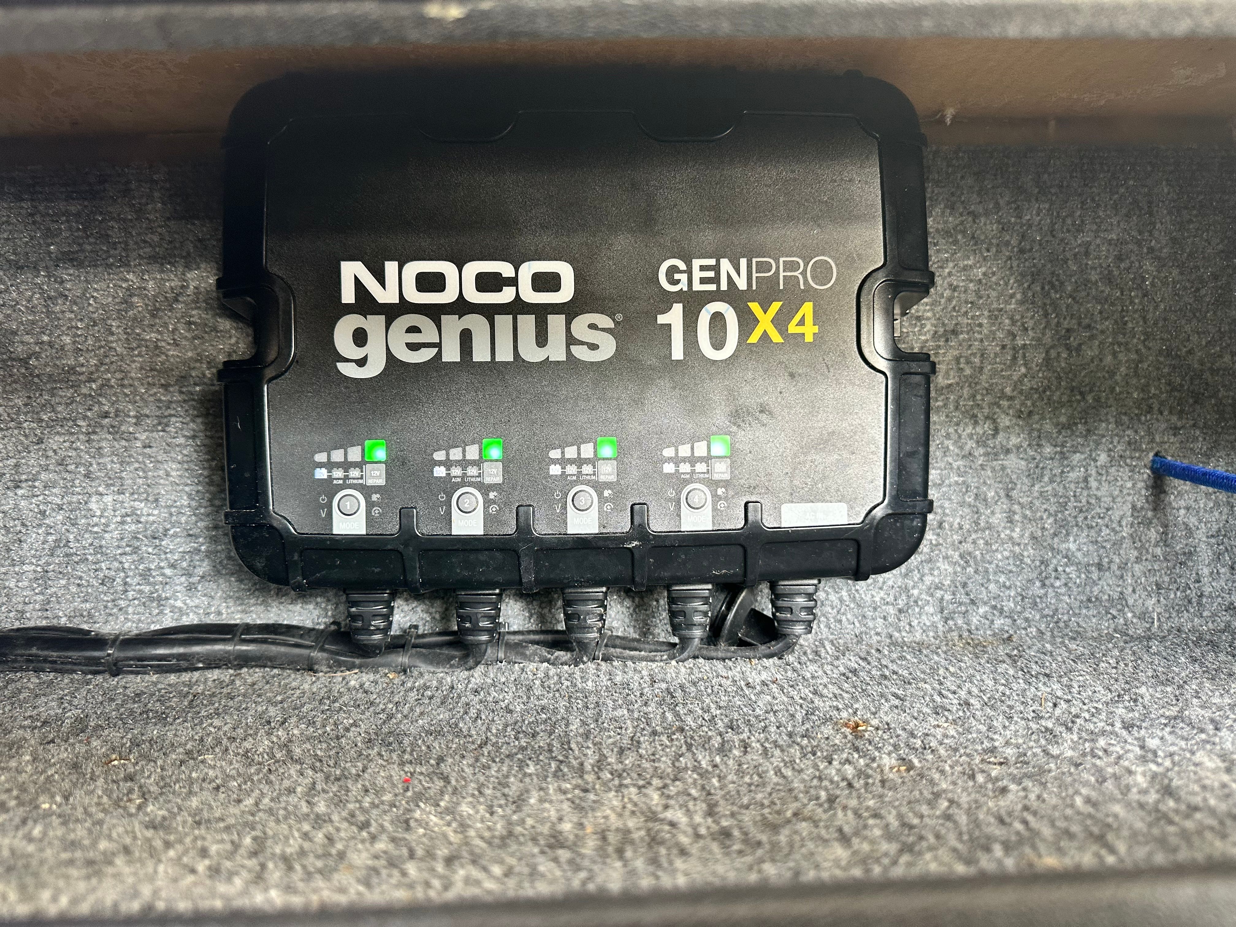 A NOCO Genius GENPRO 10X4 charger installed in a boat.