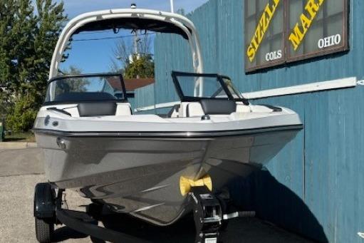 2026 Yamaha Boats 195S on trailer, parked near blue wall, sunny day.