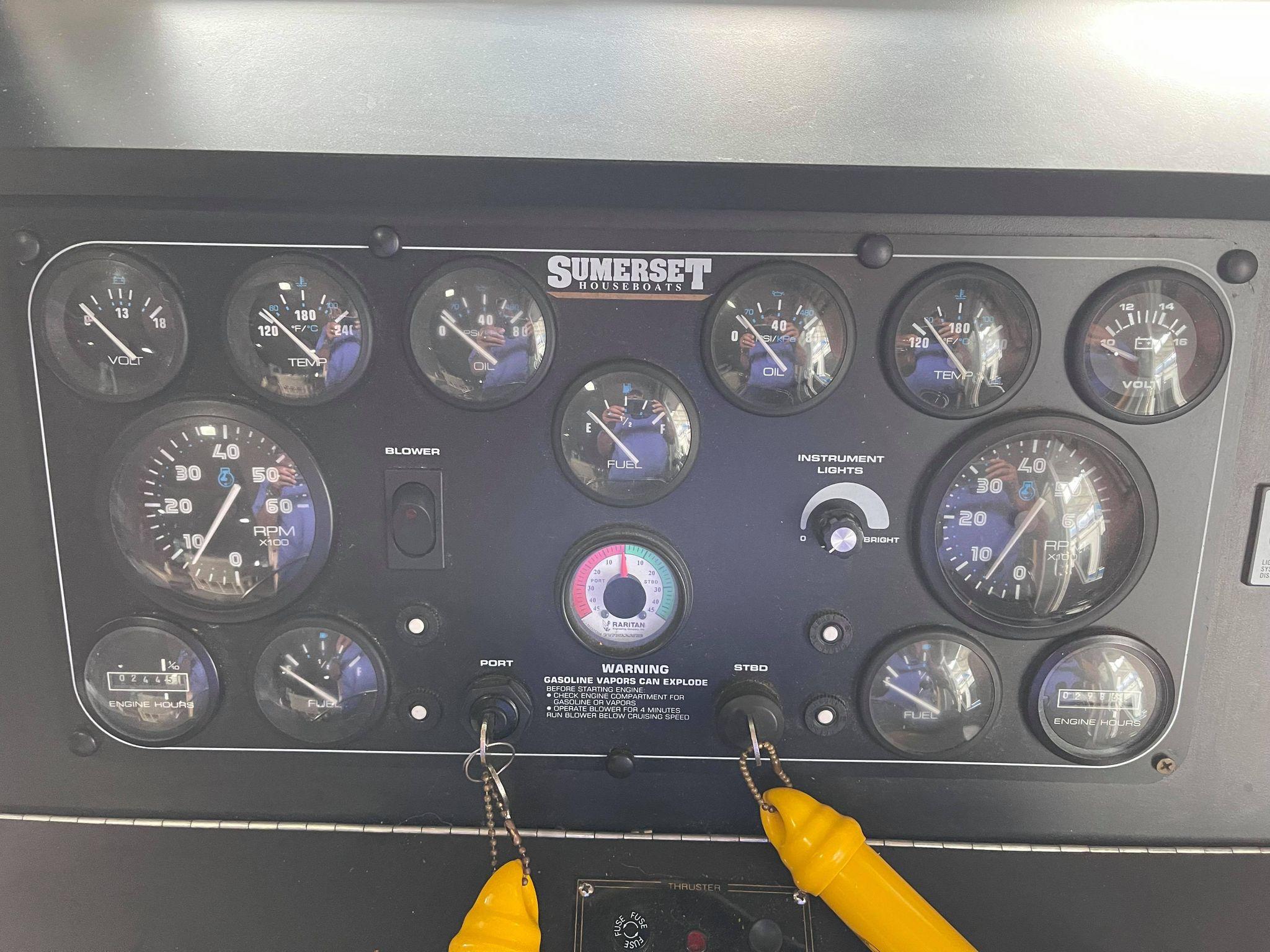 1998 Sumerset 86' by 18' houseboat control panel with gauges and switches.