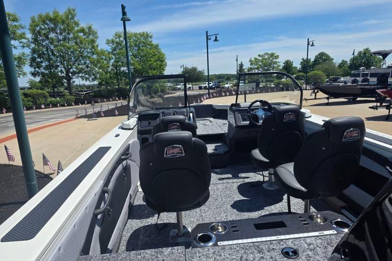 2026 Ranger VX1888 WT boat interior with seating and dashboard, parked outdoors.