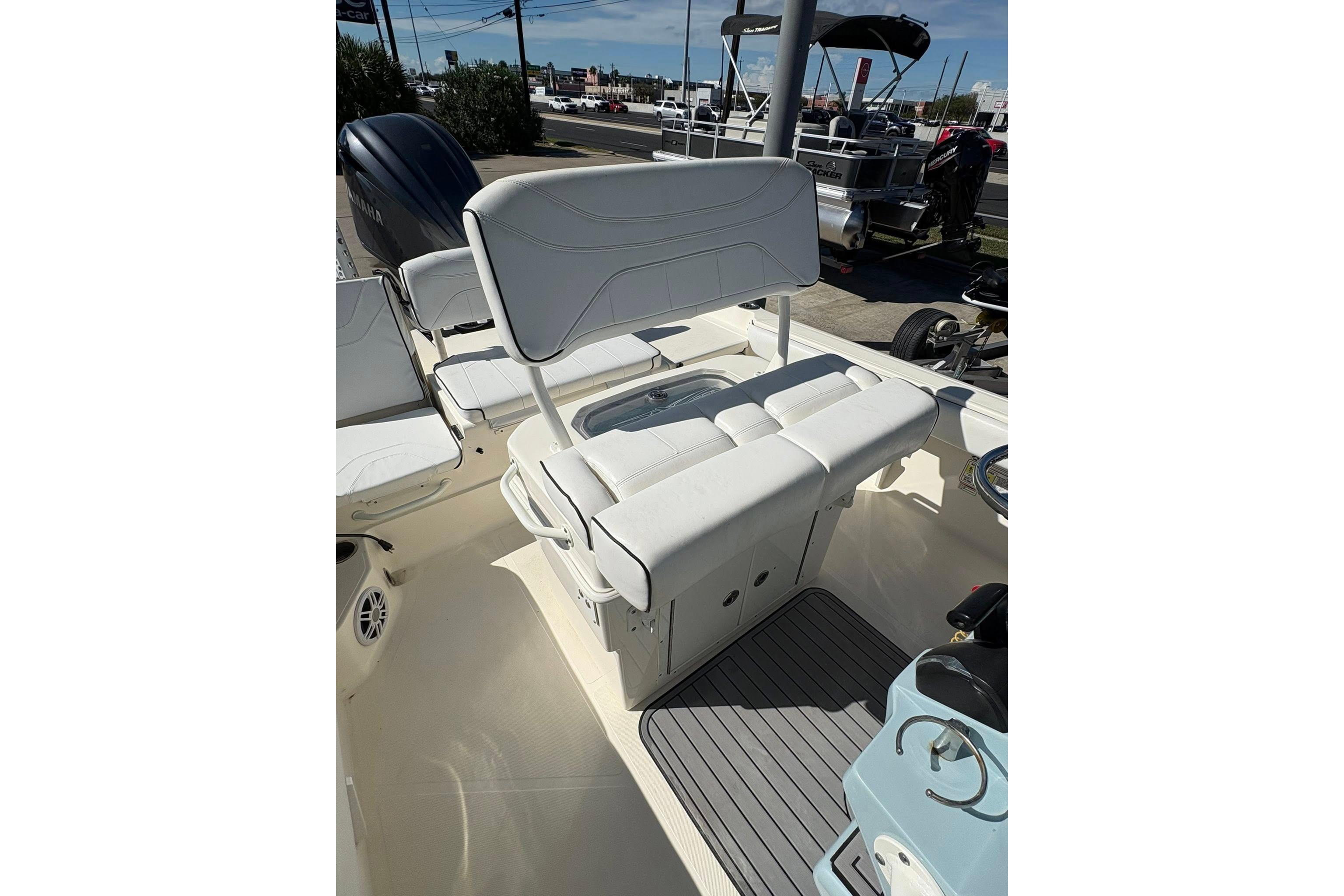 2023 Skeeter SX2550 Family boat interior with white seating and modern design.