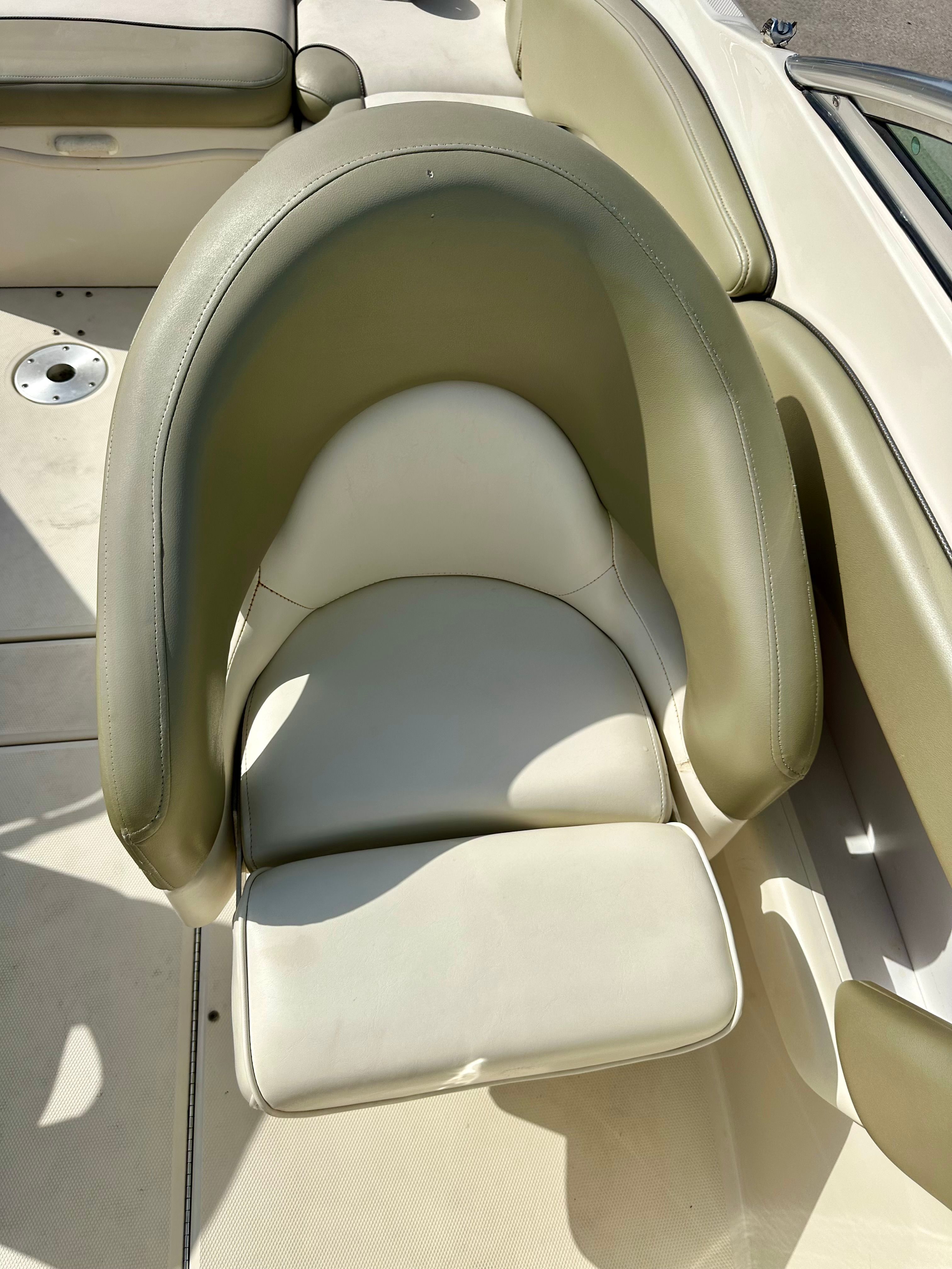 2006 Sea Ray 240 Sundeck seat, cream leather, close-up.
