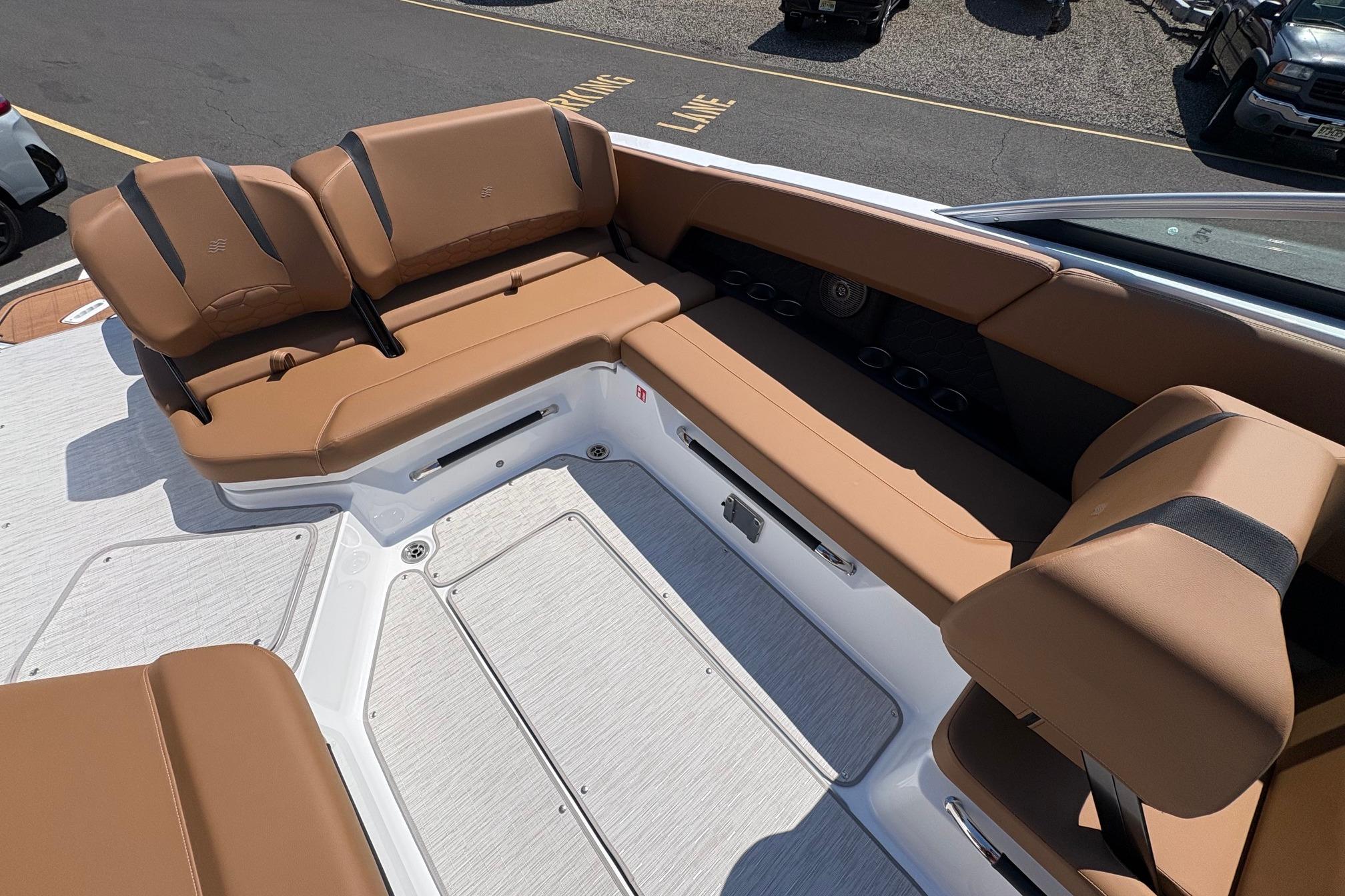 Luxurious seating area on the 2026 Four Winns H6 boat, featuring tan upholstery.