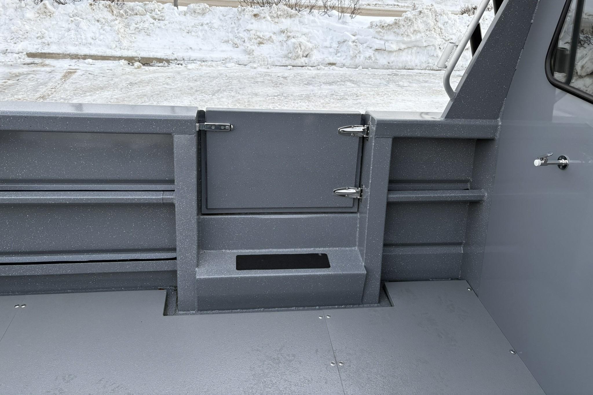 2024 Spartan 26 Maximus Pro XL boat interior with gray textured finish and storage compartments.