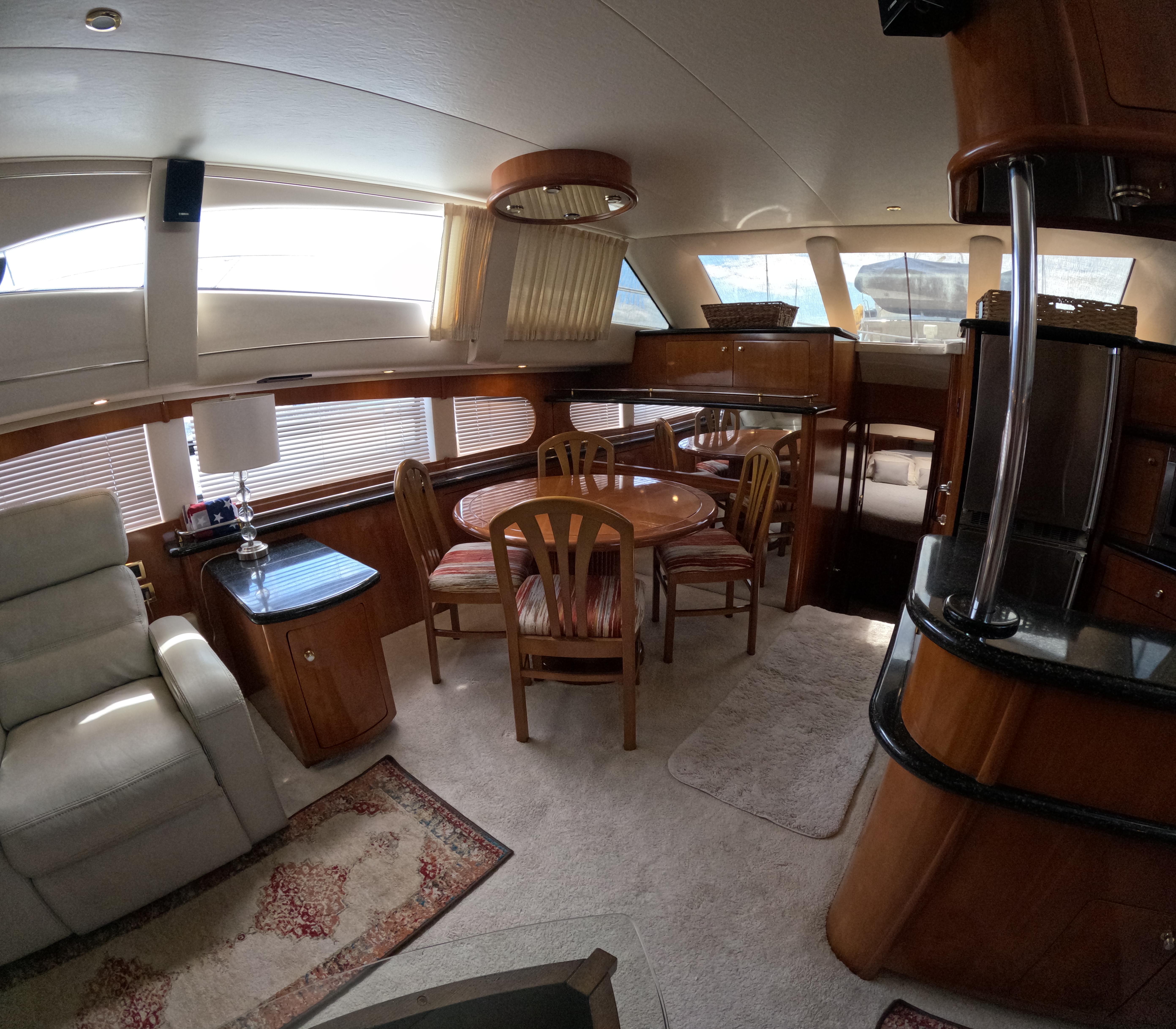 Interior of 2001 Carver 506 Motor Yacht with dining area and seating.