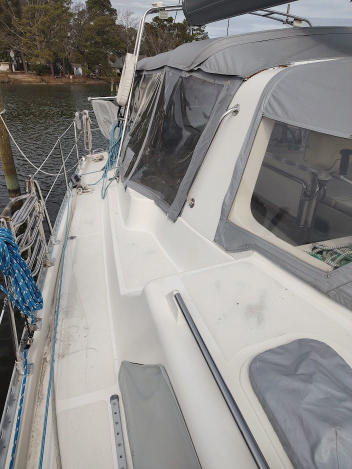 2005 Stevens Custom 53/56 sailboat docked, featuring a covered cockpit and sleek deck design.