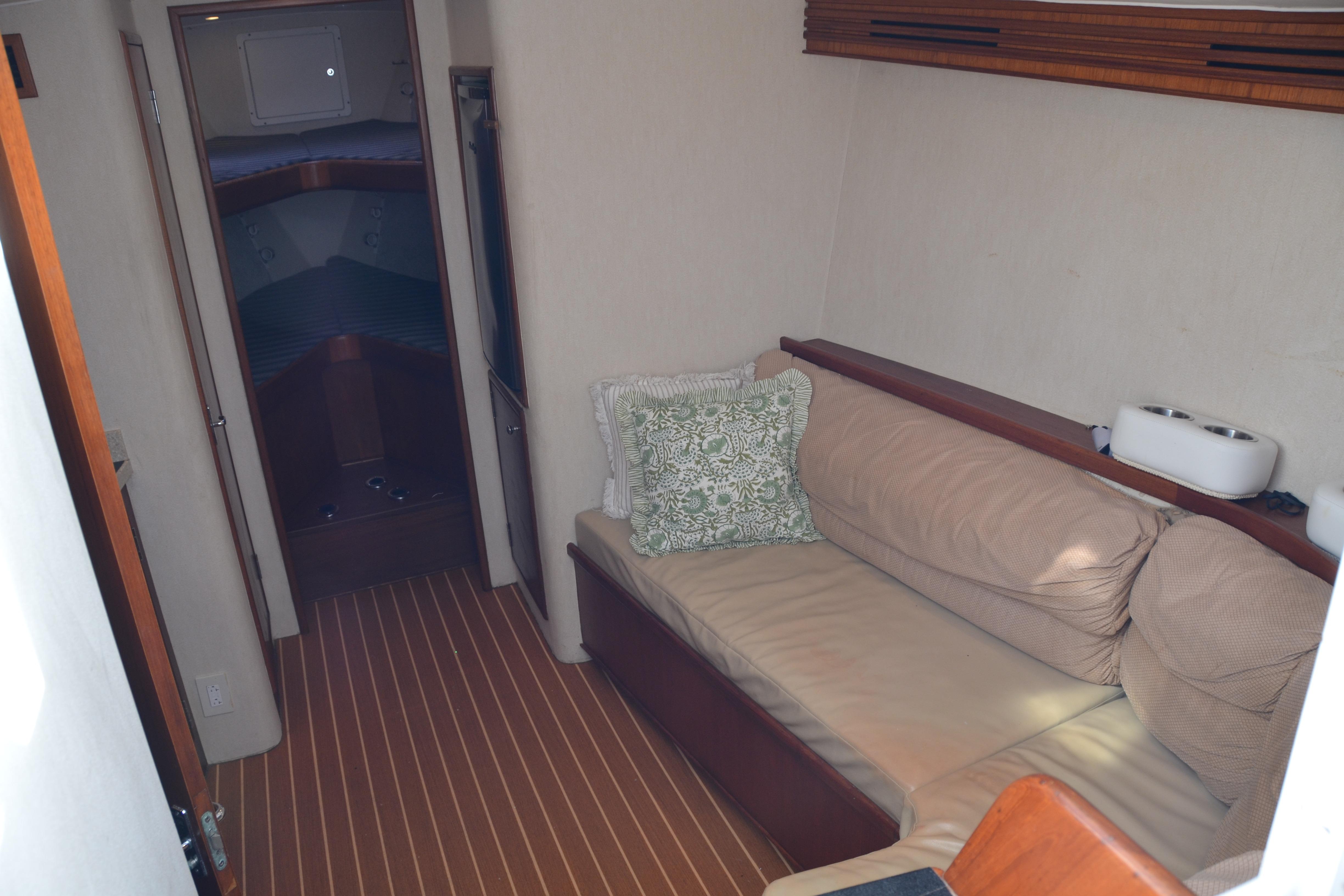 2006 Custom Carolina Heritage Express yacht interior with cozy seating and elegant wood finishes.