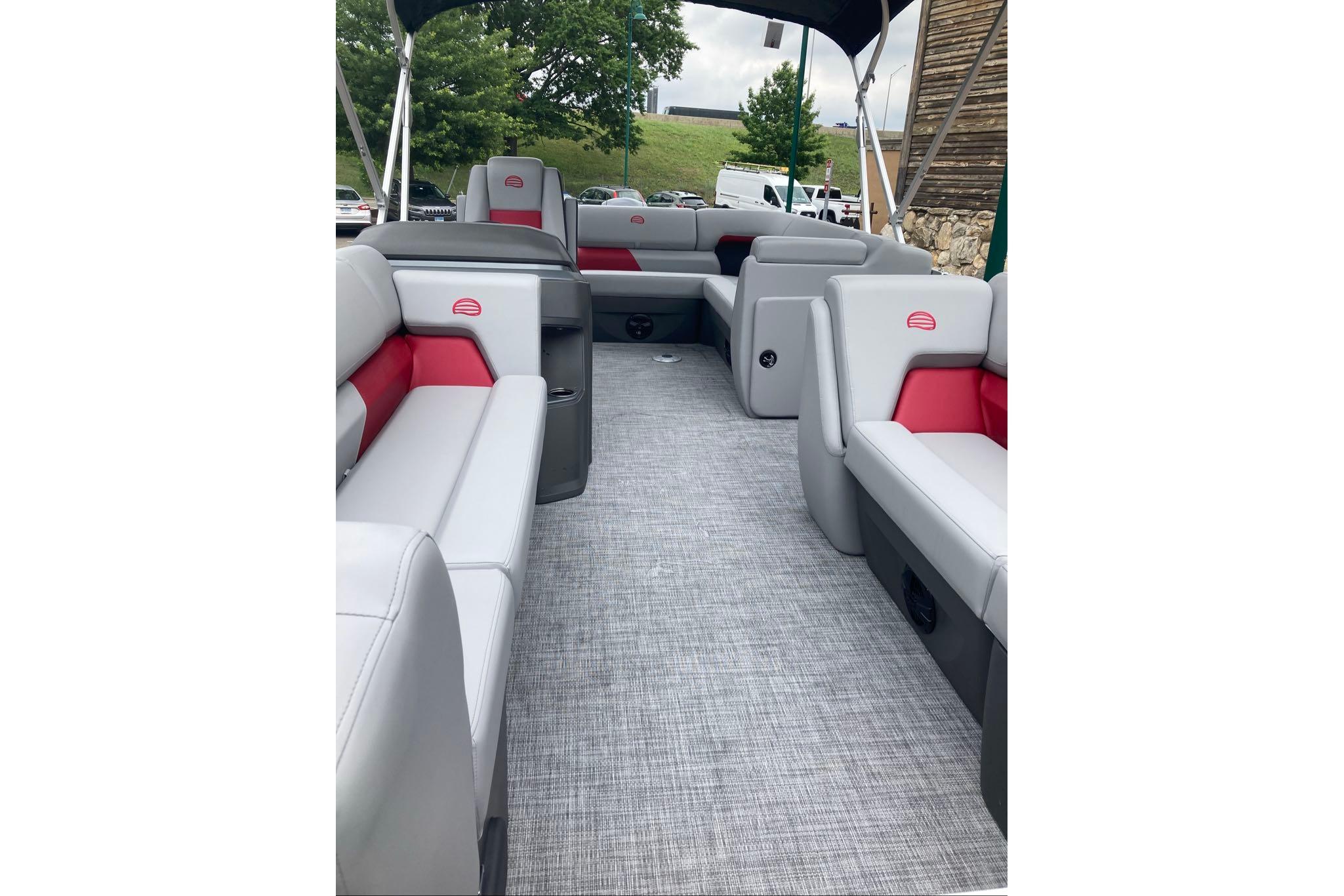 2026 Sun Tracker Party Barge 20 DLX interior with gray and red seating, spacious layout.