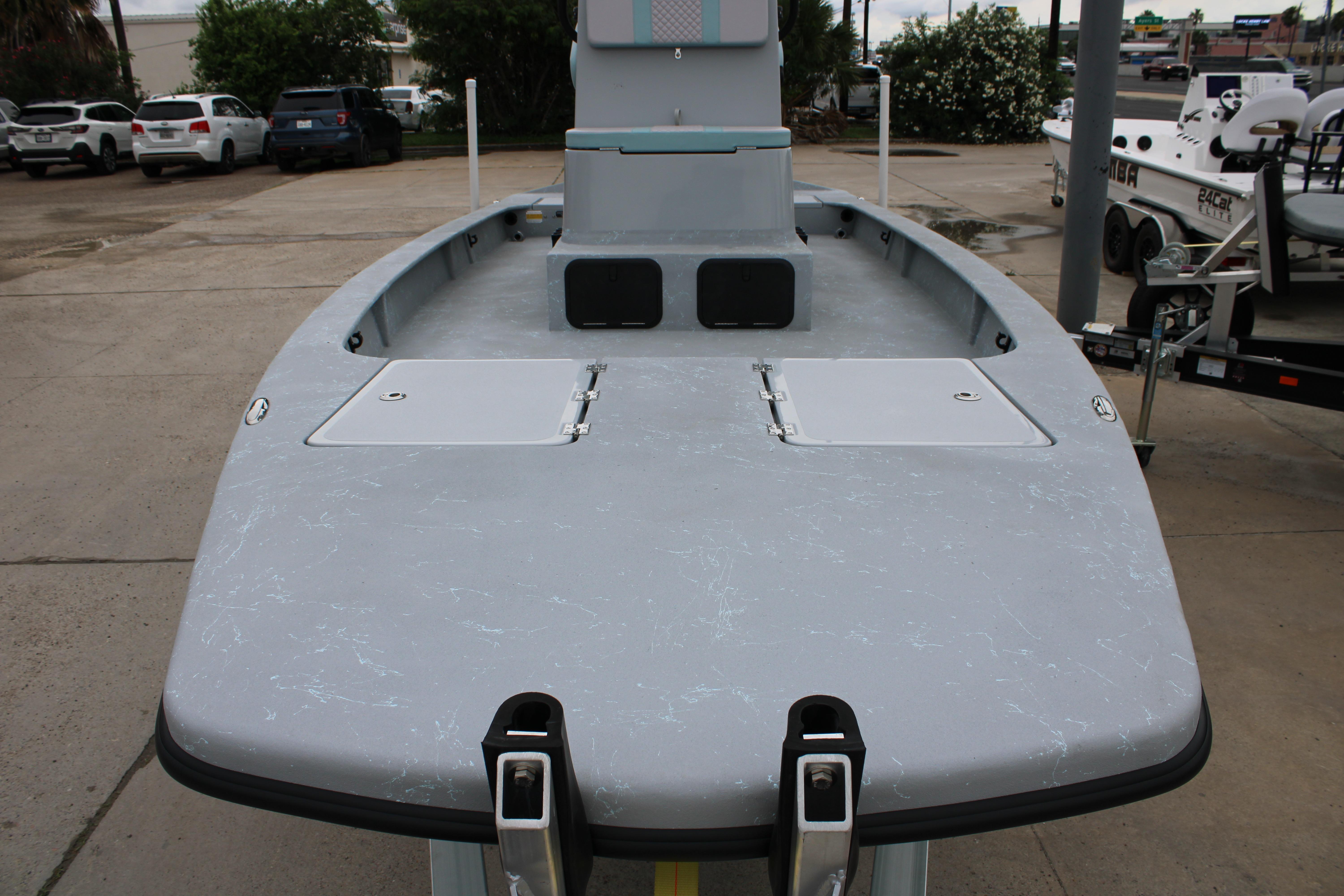 2026 Freedom Boats 24 Defender, gray deck view, parked outdoors.