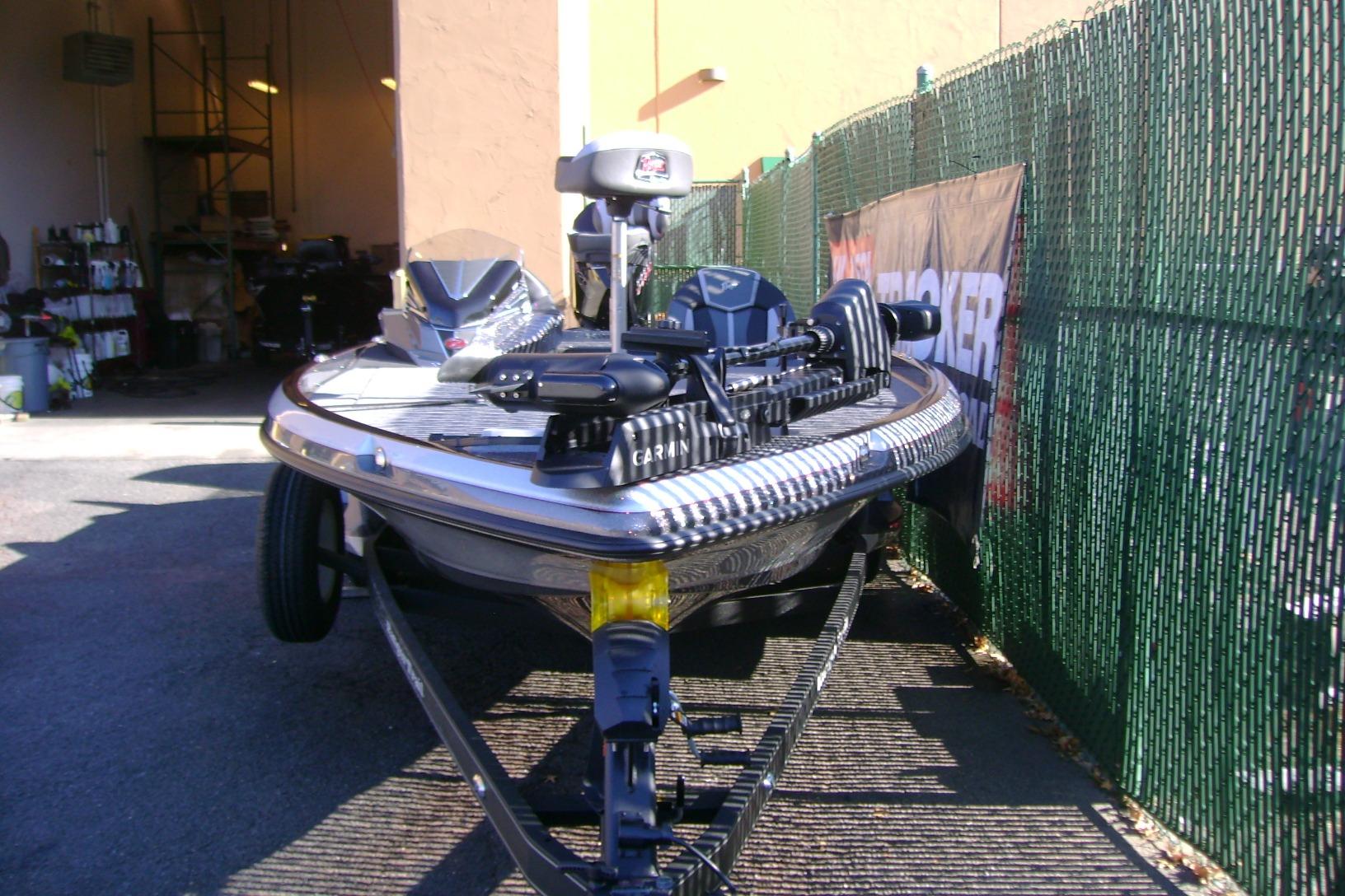 2025 Ranger Z520 boat parked near a fence, showcasing sleek design and modern features.