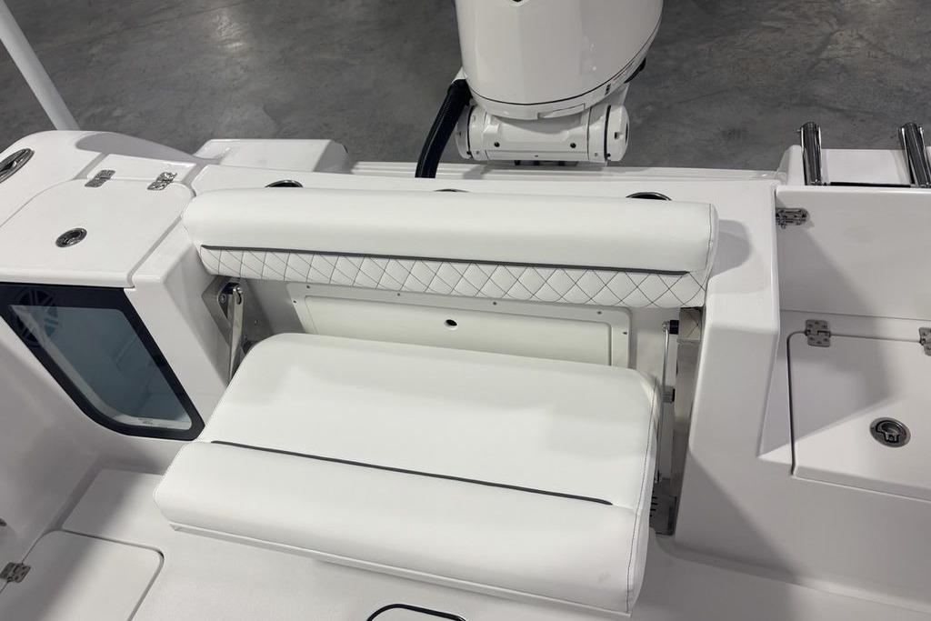 2026 Sportsman Open 252 Center Console boat interior with white cushioned seating.