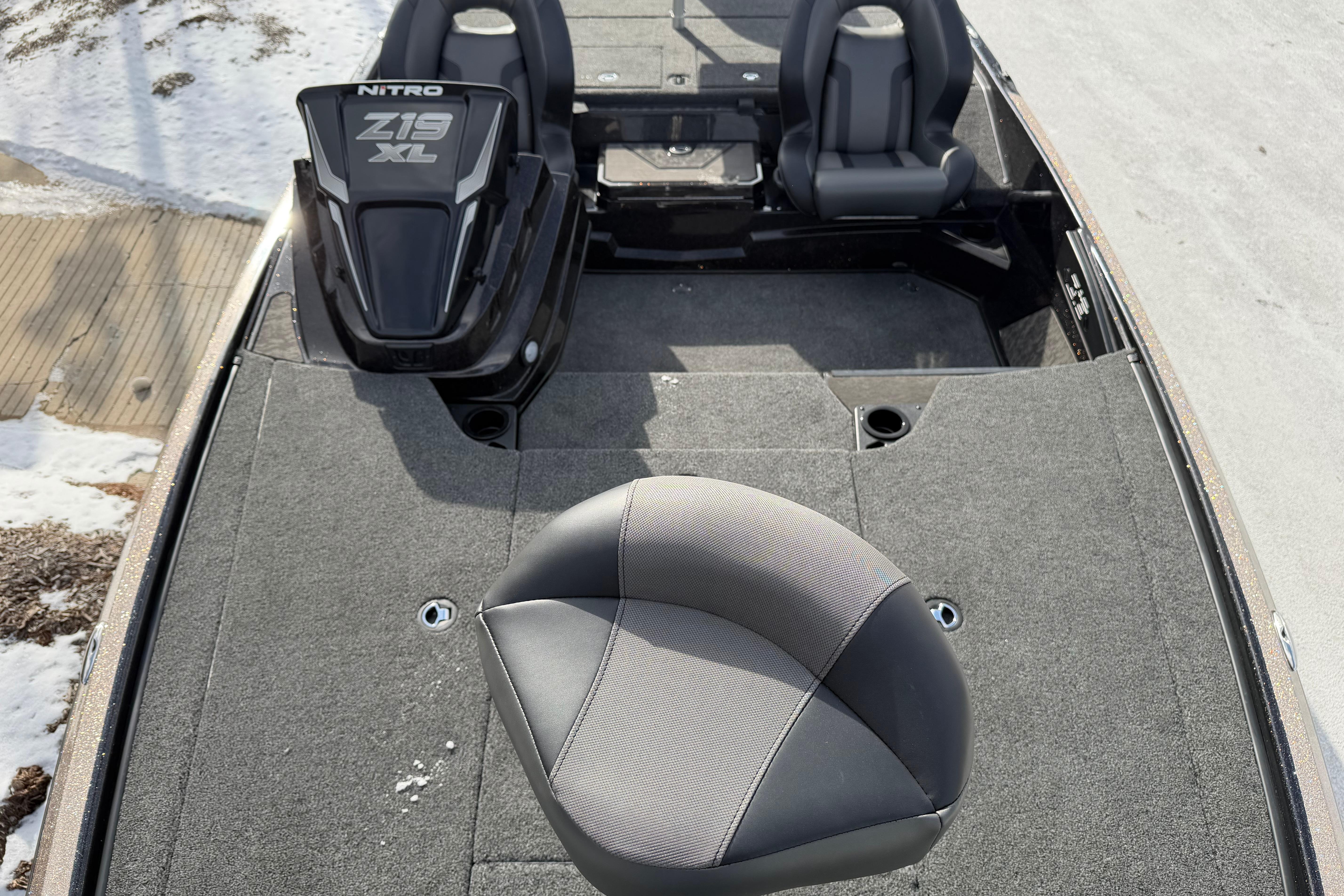 2026 Nitro Z19 XL Pro boat interior with seating and carpeted deck.
