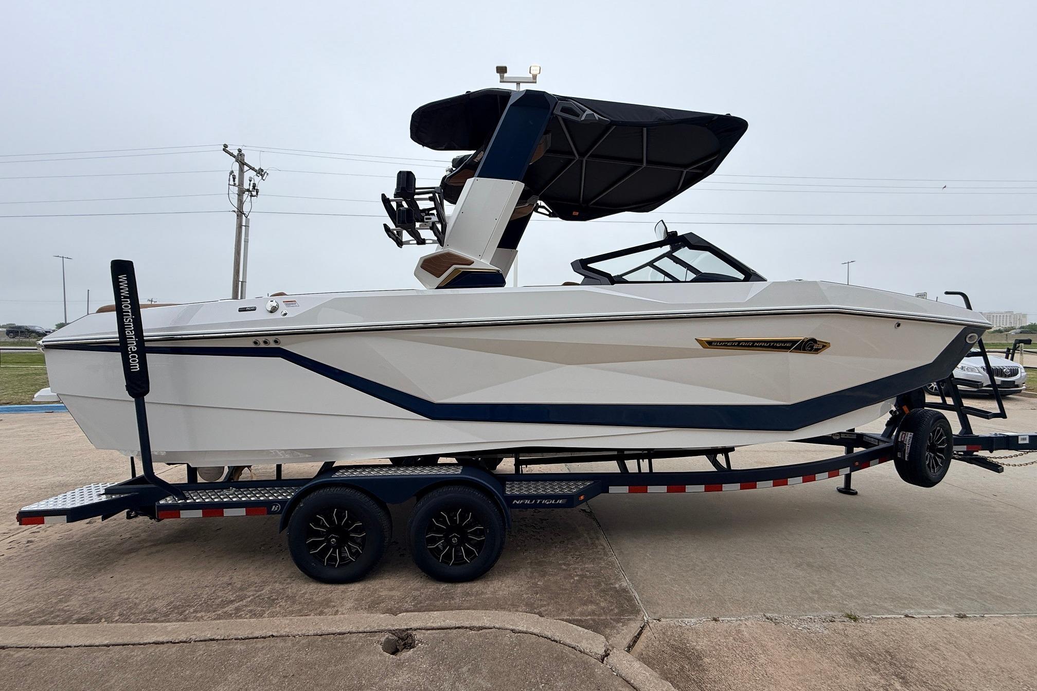 2026 Nautique Super Air Nautique G25 boat on trailer, side view.