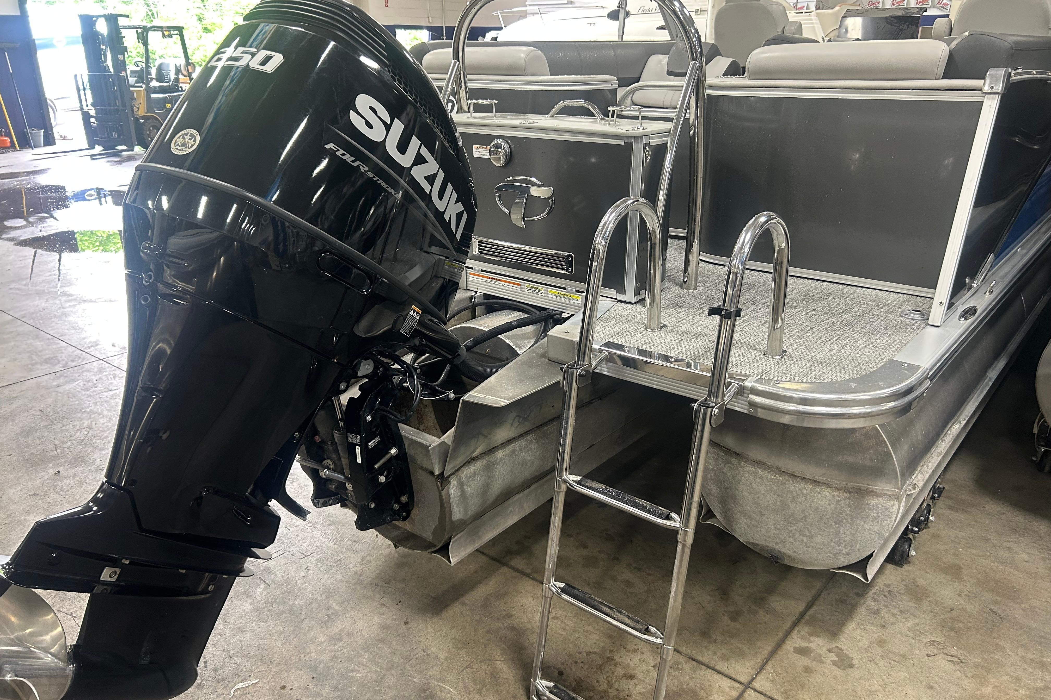 2022 Tahoe Pontoon Cascade Quad Lounger with Suzuki outboard motor and boarding ladder.
