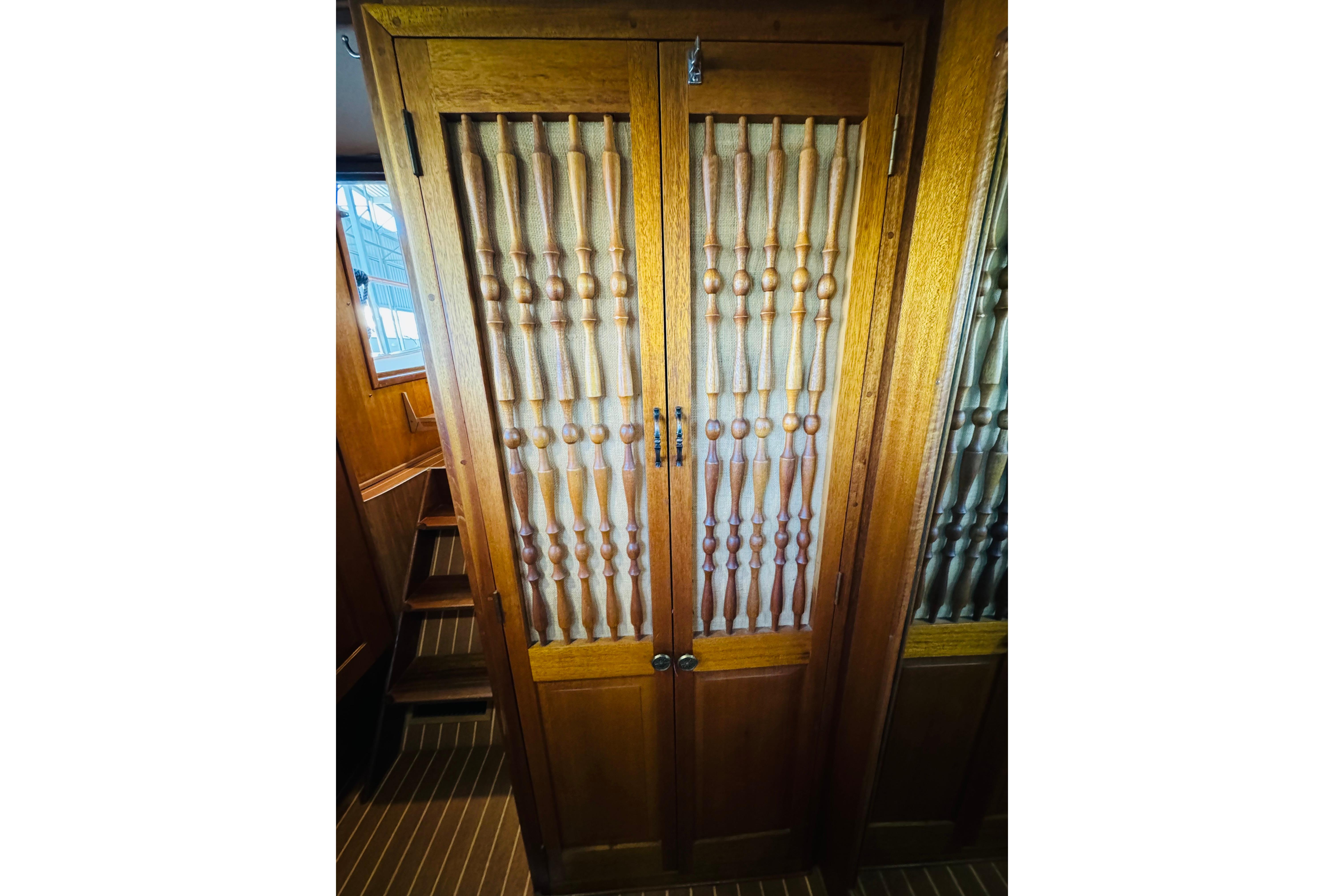 Wooden cabinet doors with intricate spindle design on a 1978 Californian 42 LRC yacht.