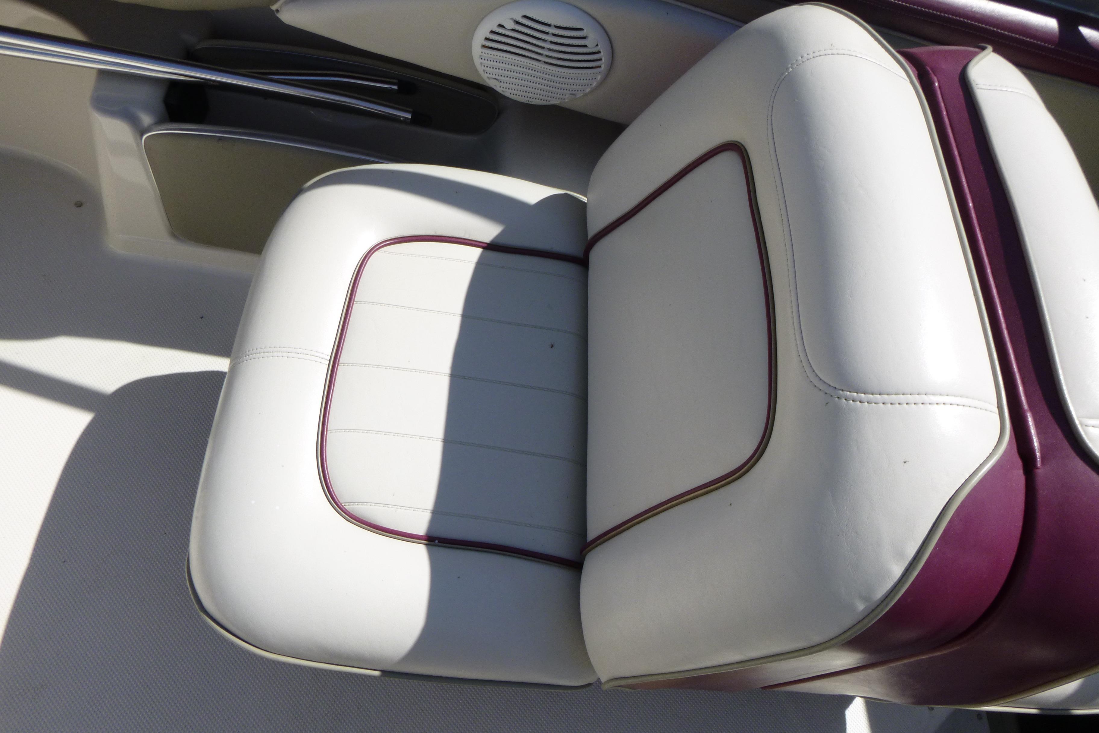 White and maroon boat seat in a 1998 Maxum 2300 SC.