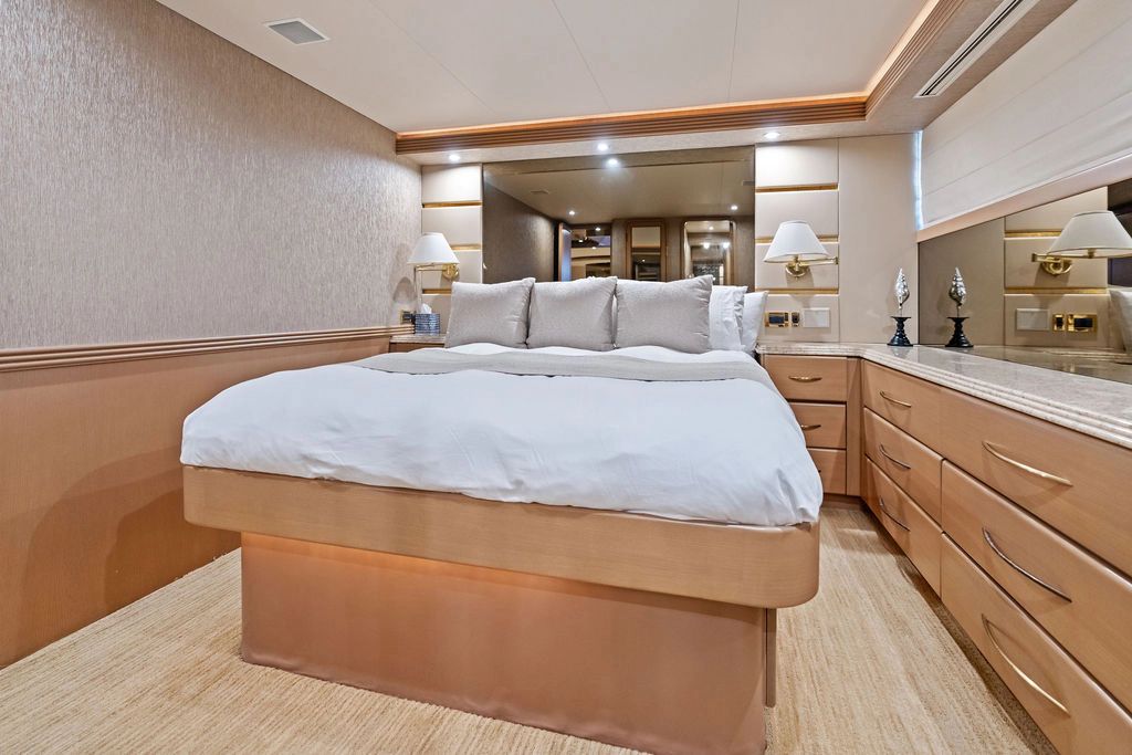 Luxurious bedroom on a 1999 Westport 112 yacht.