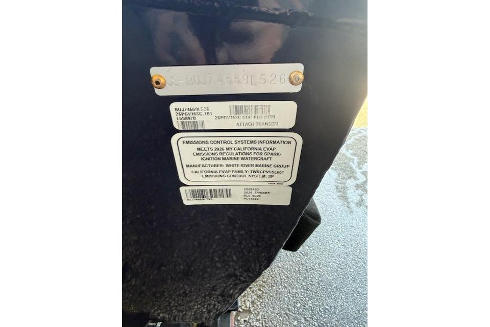 2026 Tracker Pro Guide V-16 SC emissions control information label on boat hull.