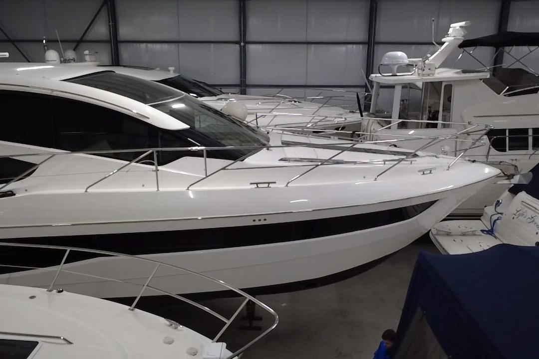 2018 Galeon 560 Sky yacht in indoor storage, showcasing sleek design and modern features.