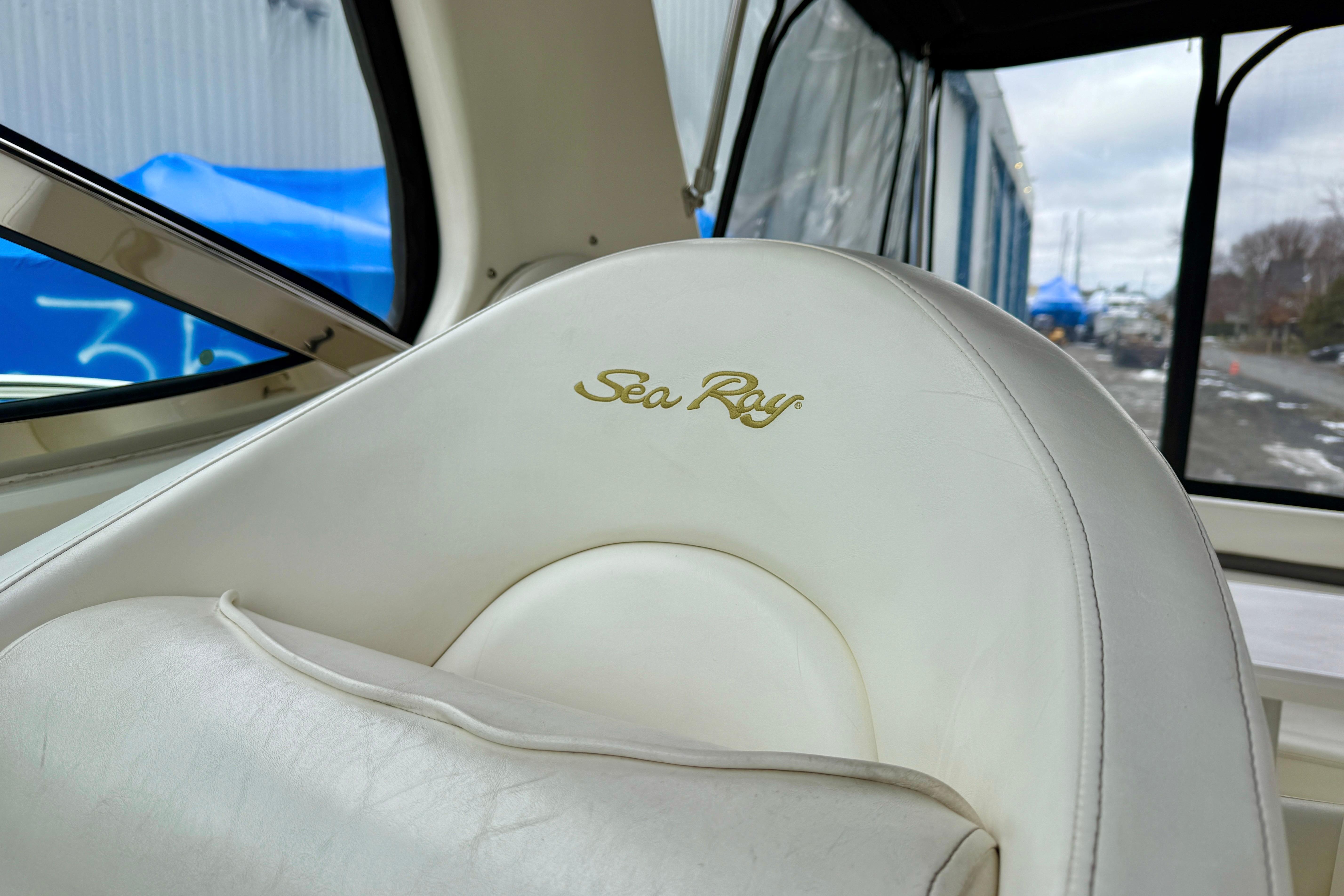 White leather seat with "Sea Ray" logo on a 2004 Searay 360 Sundancer boat.