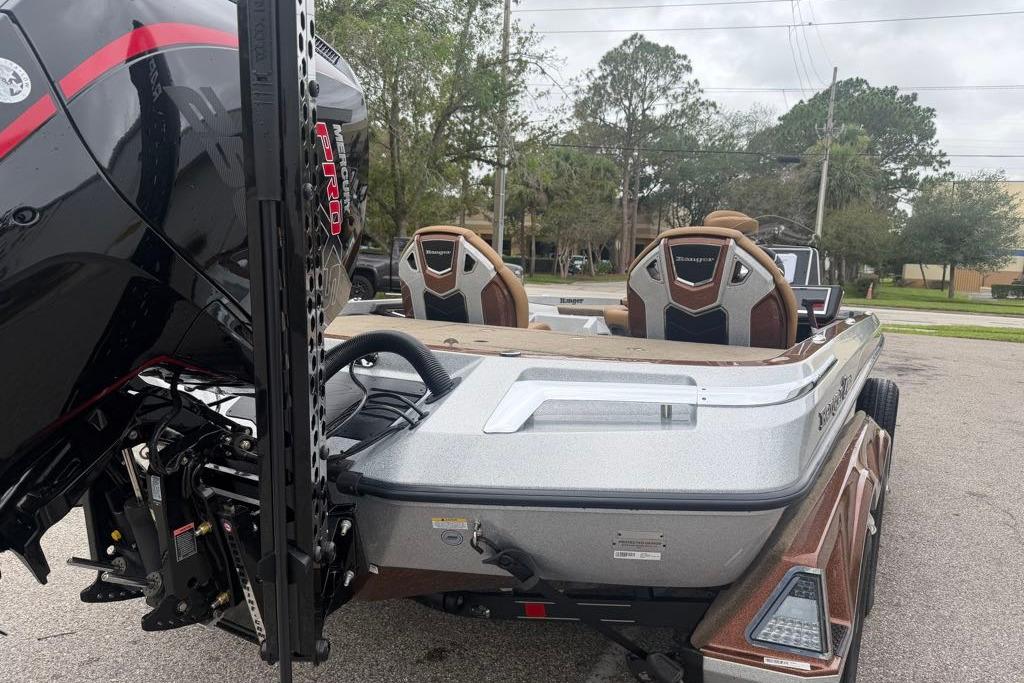 2026 Ranger Z520R boat with powerful engine, parked outdoors, showcasing sleek design and seating.