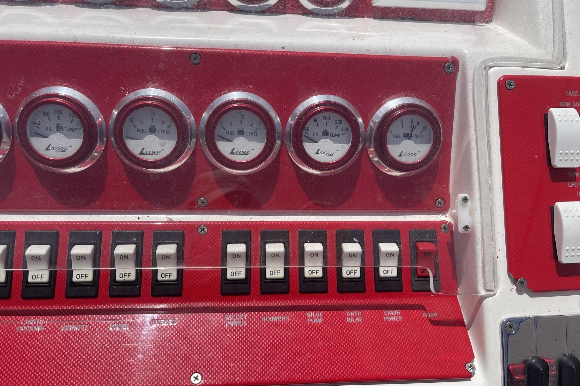 Control panel of a 2006 Sonic 386 boat with gauges and switches.