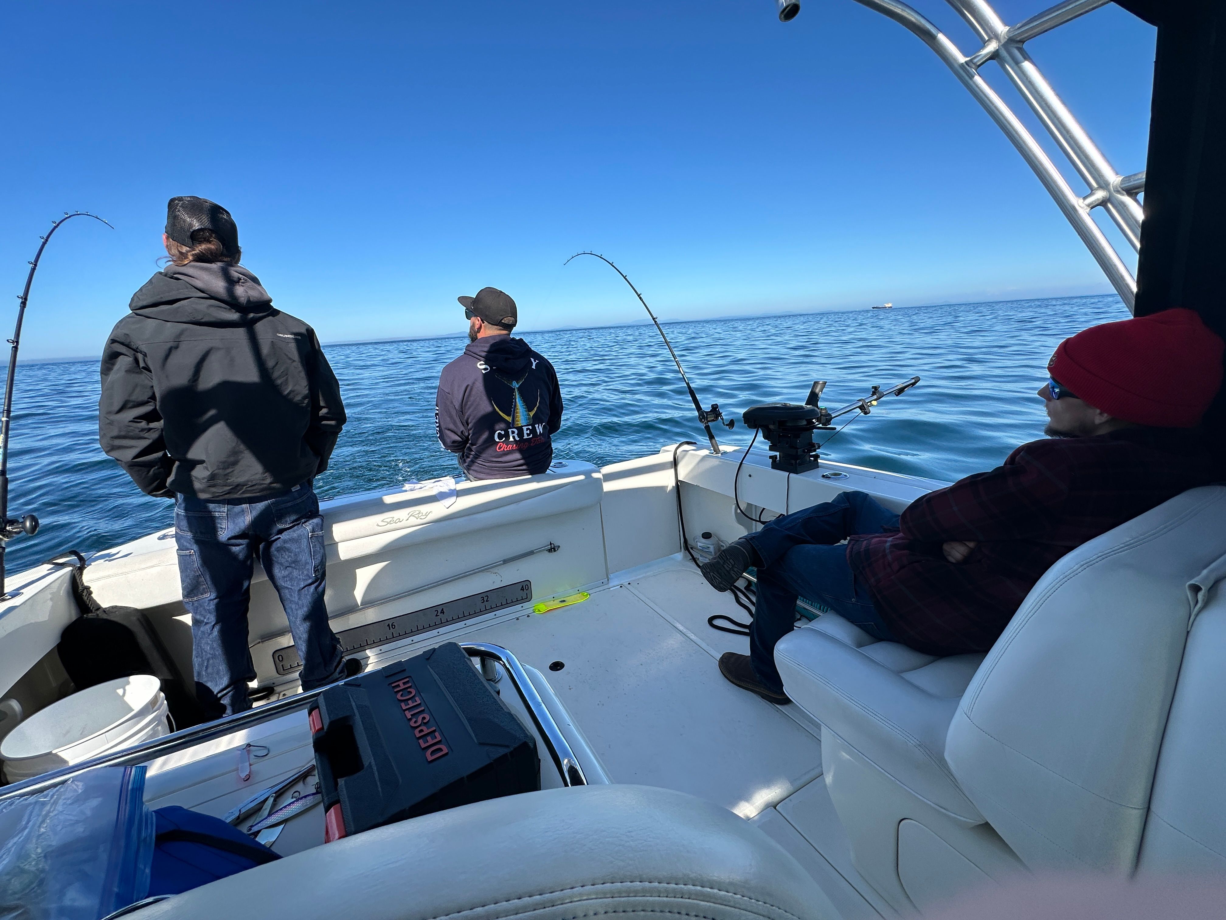 Anglers on a 2005 Sea Ray 290 Amberjack boat fishing.