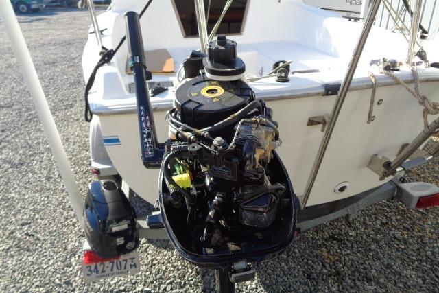 2007 Sanibel by International Marine 18 Pocket Cruiser with outboard motor, rear view.