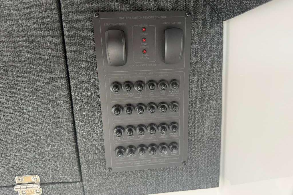 Control panel on 2026 Monterey Elite 30 OB boat, featuring switches and indicators.