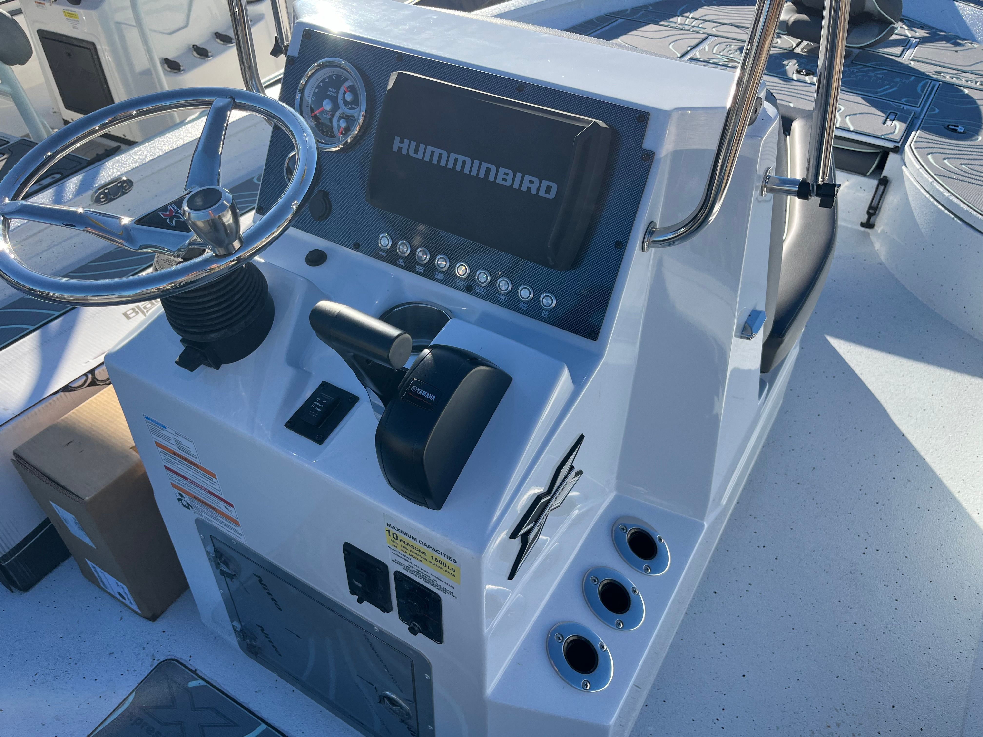 Xpress X23B Bay Lounge 2024 helm with Humminbird system.