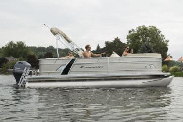 Manufacturer Provided Image: 2020 Starcraft EX 20 C pontoon boat on a lake with people onboard.