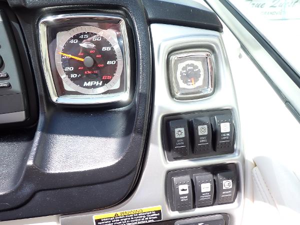 Dashboard of 2011 Chaparral 287 SSX boat with speedometer and control switches.