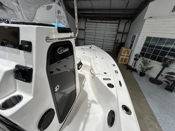 2025 Sea Pro 210 Bay boat interior in a garage setting.