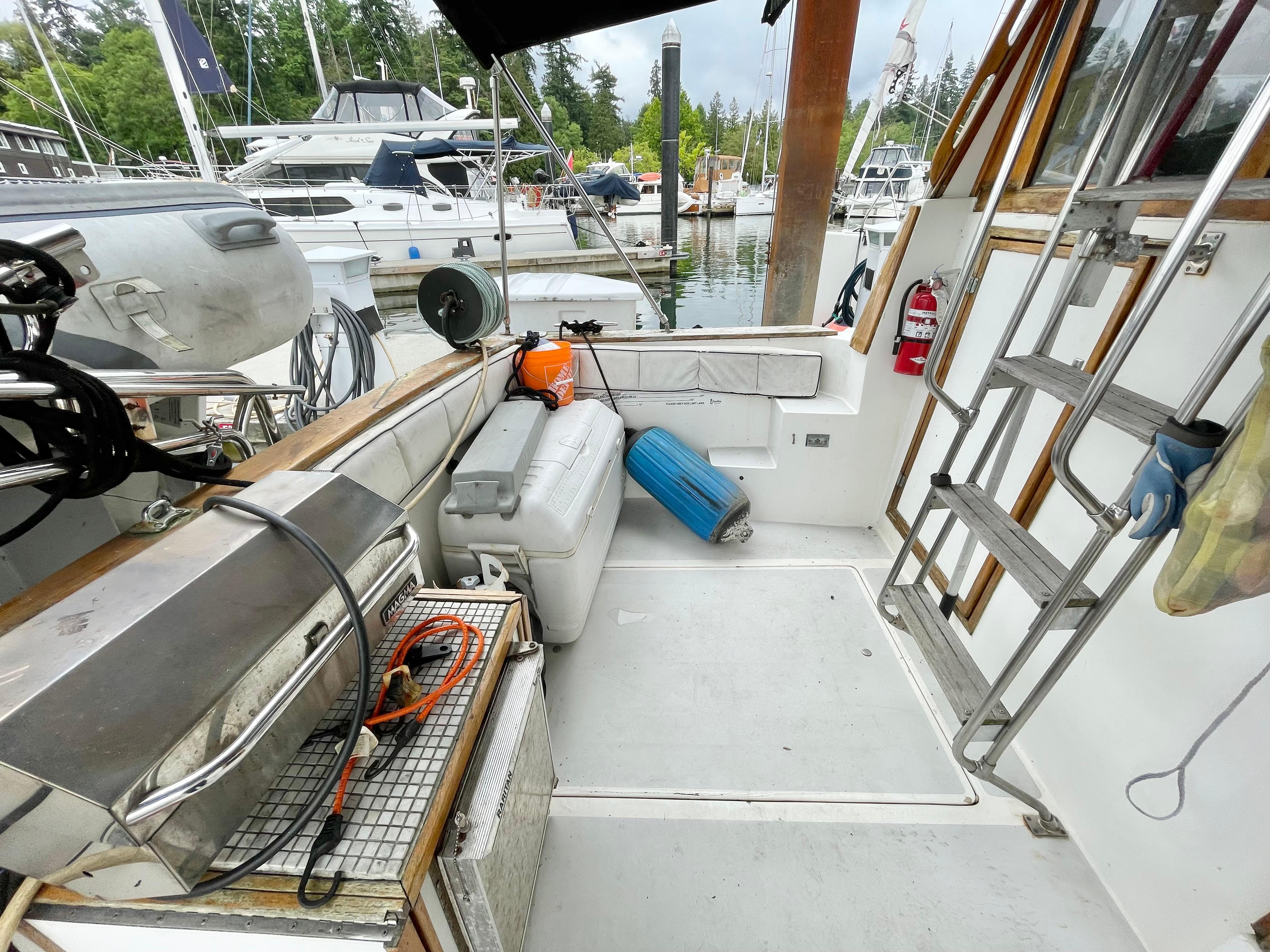 1987 Bayliner 3870 Motoryacht deck with equipment, docked at marina.