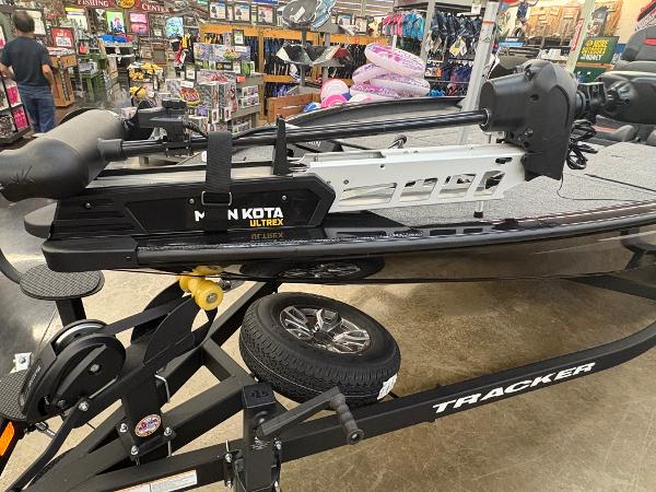 2025 Tracker Savage 215 boat with Minn Kota Ultrex motor in a store display.