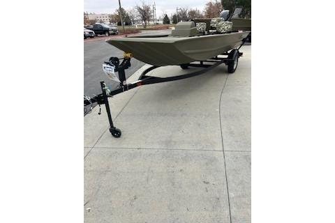 2026 Tracker Grizzly 1754 SC boat on trailer, parked outdoors.