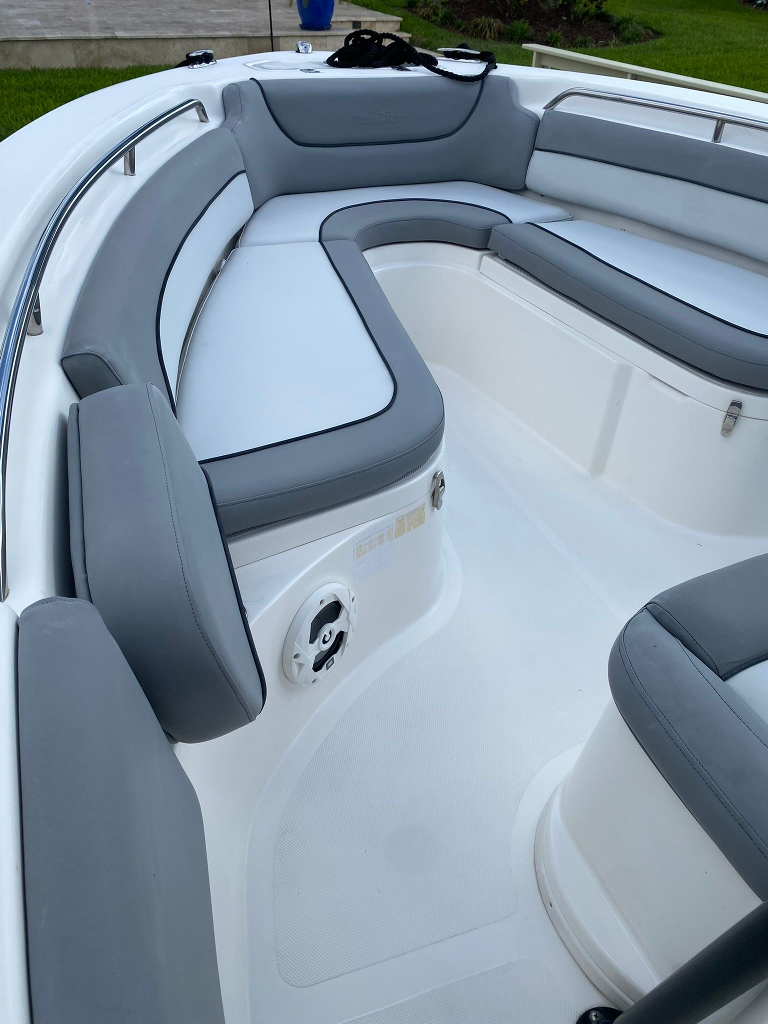 Interior view of a 2021 NauticStar Legacy boat with gray upholstery.