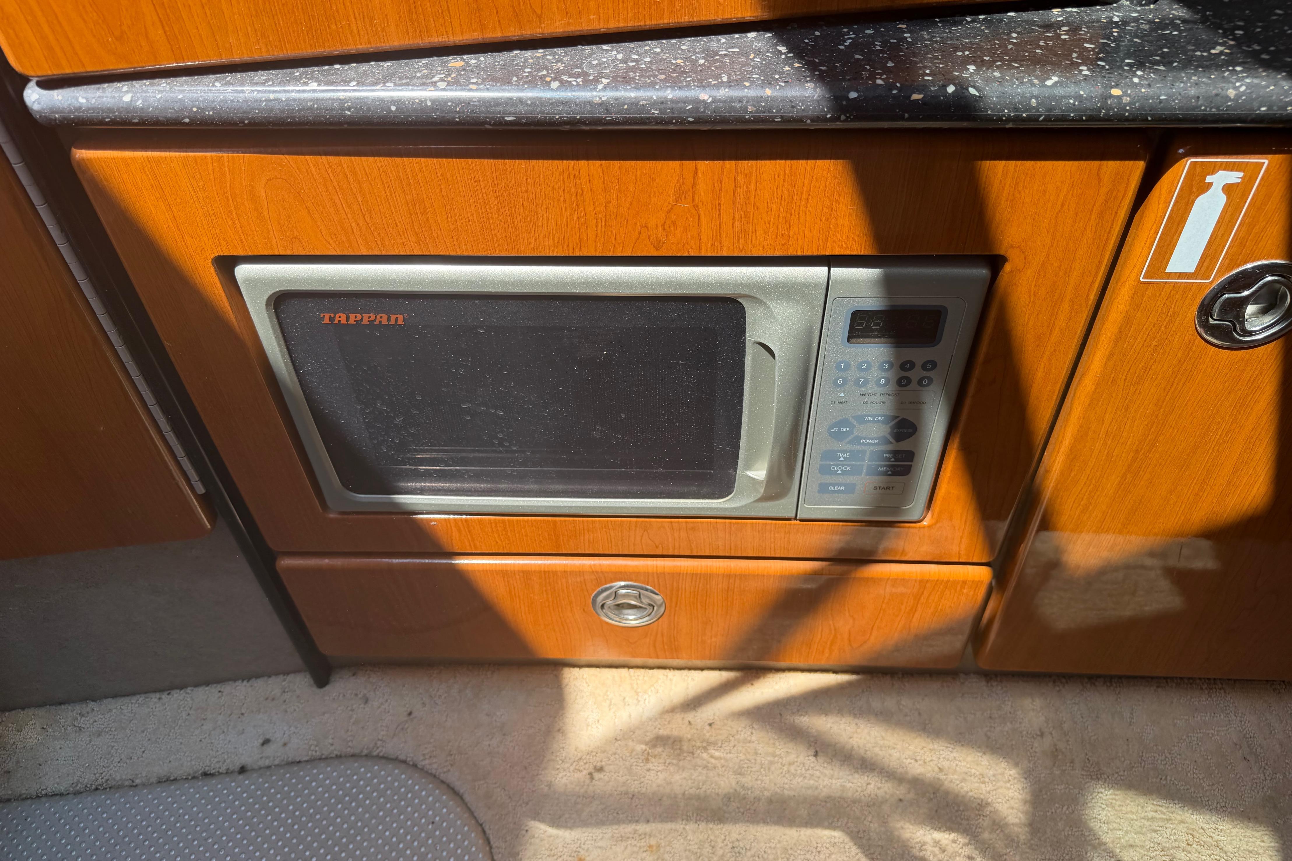 Built-in microwave in 2006 Formula 330 Sun Sport boat kitchen area.
