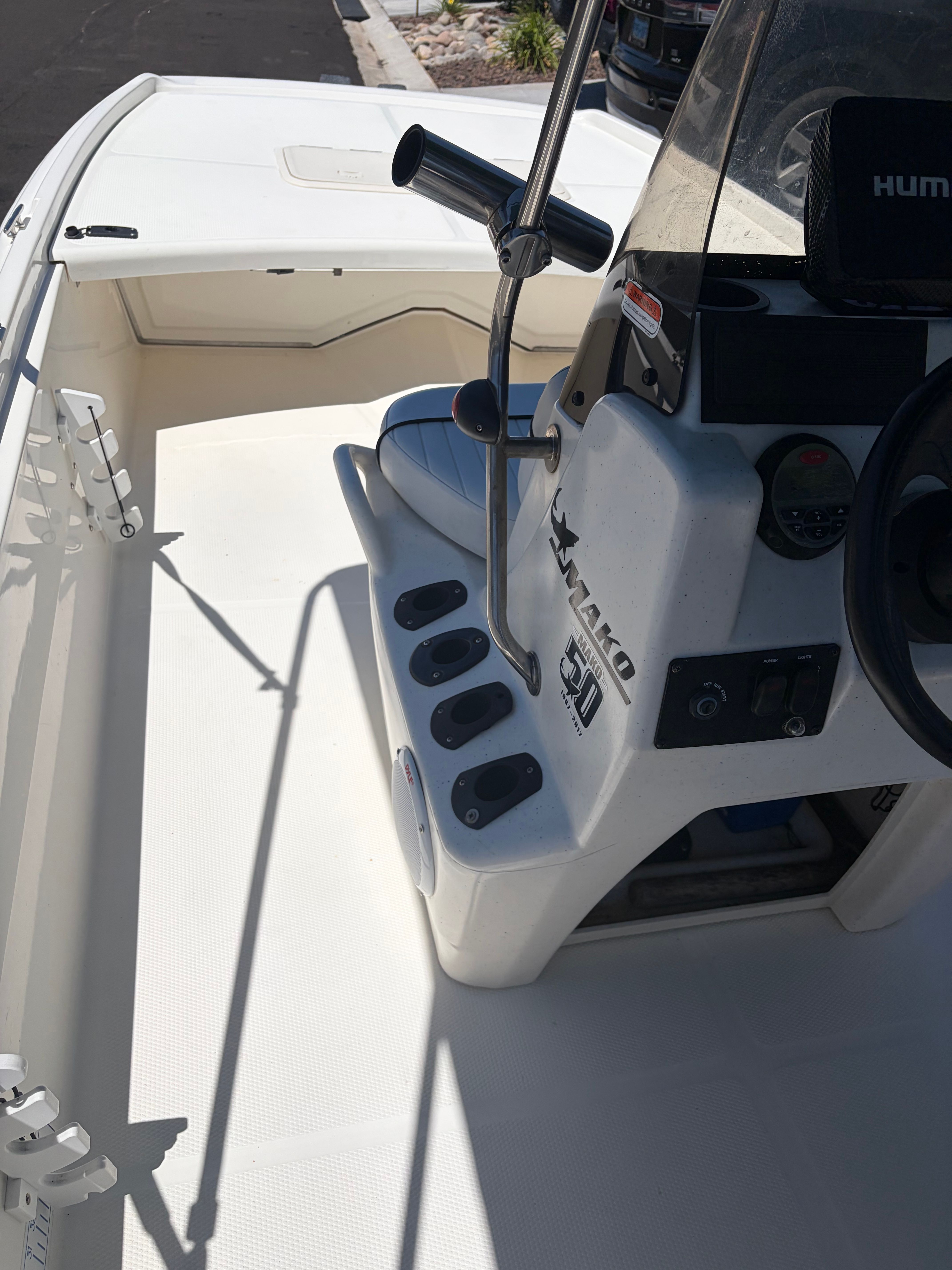 The image shows the cockpit of a 2017 Mako Pro Skiff 17 CC with a steering console.