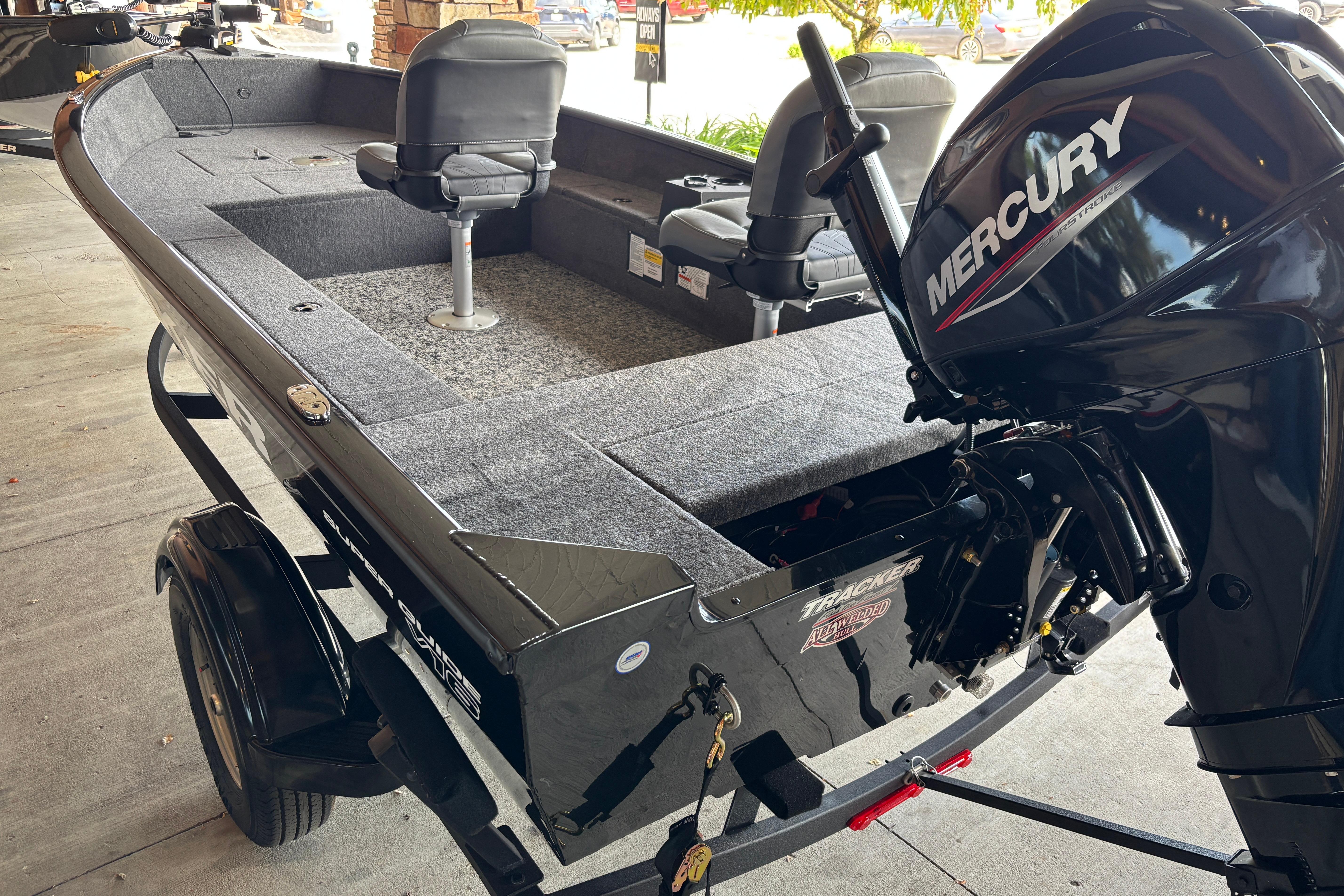 2026 Tracker Super Guide V-16 T boat with Mercury engine on trailer.